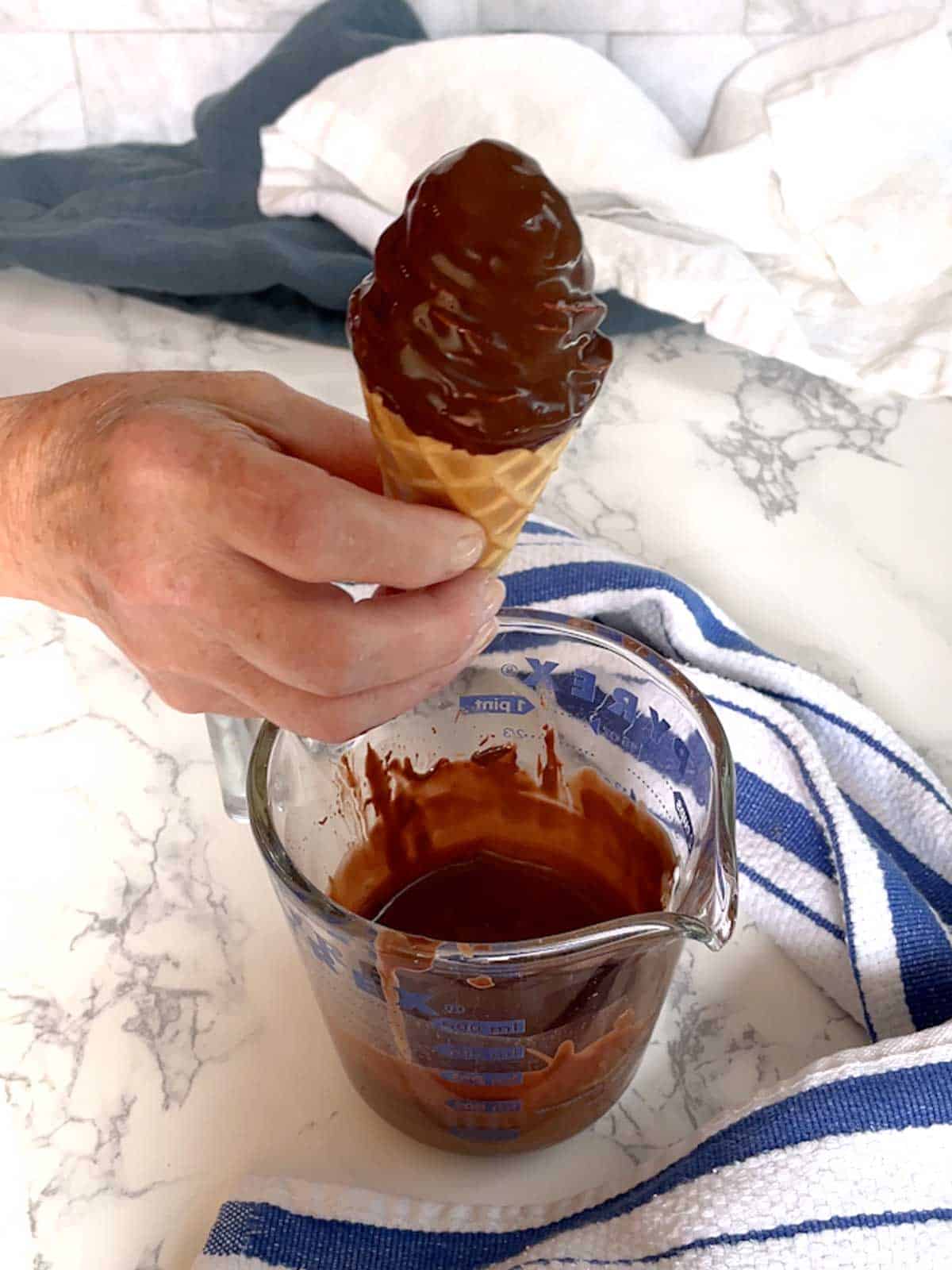 Ice cream cone dipped in magic shell.