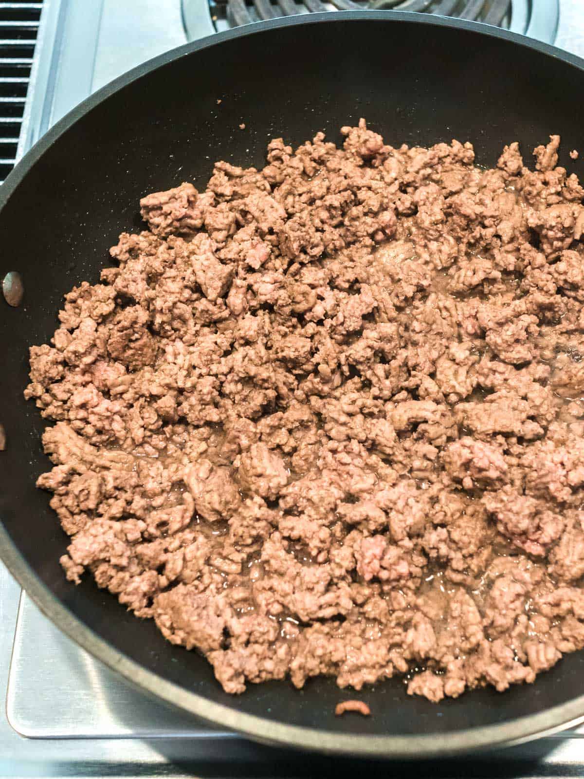 Browning Ground Beef in skillet.