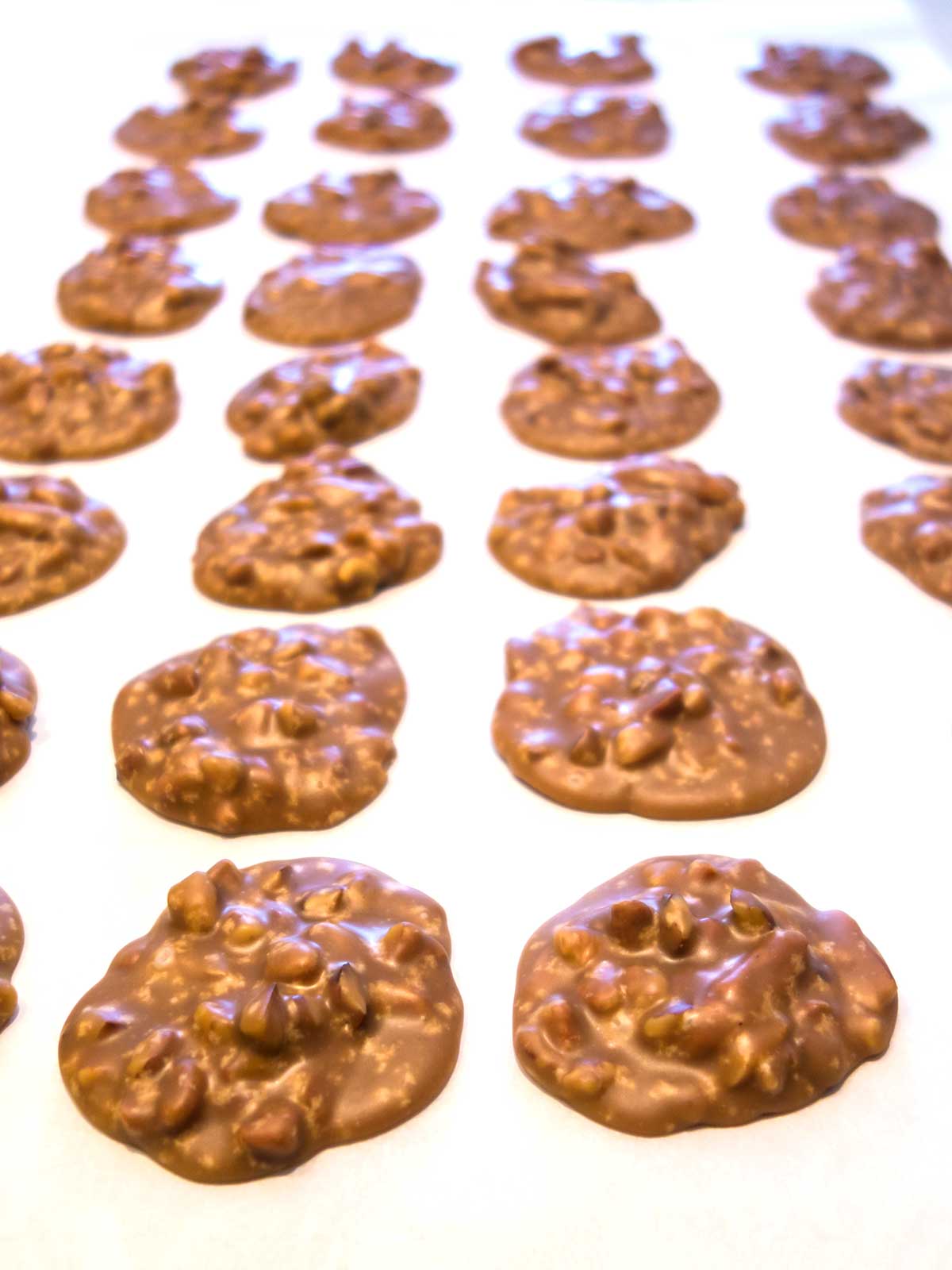 Pralines cooling on parchment paper.