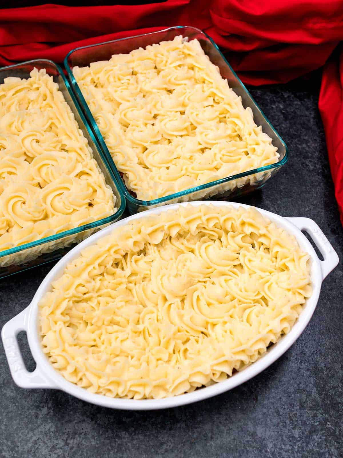 Three cottage pies ready for oven or freezer.