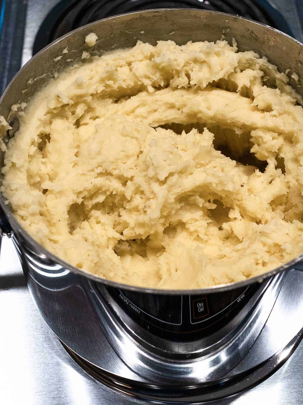 Mashed potatoes in pan.