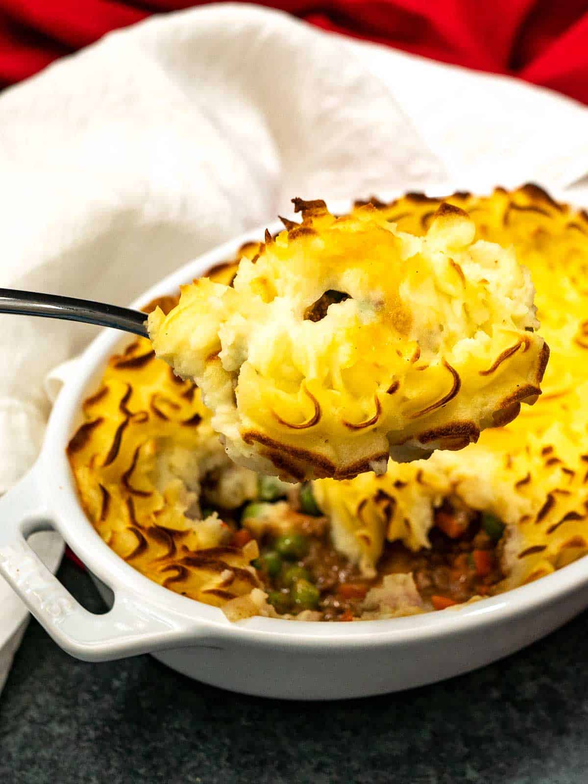 https://pudgefactor.com/wp-content/uploads/2022/01/Serving-Cottage-Pie.jpg