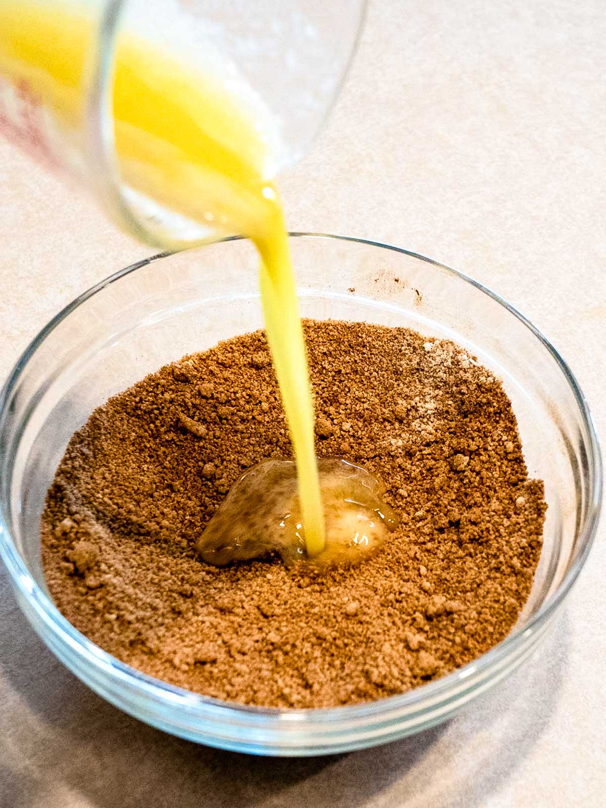 Adding butter to cinnamon mixture.