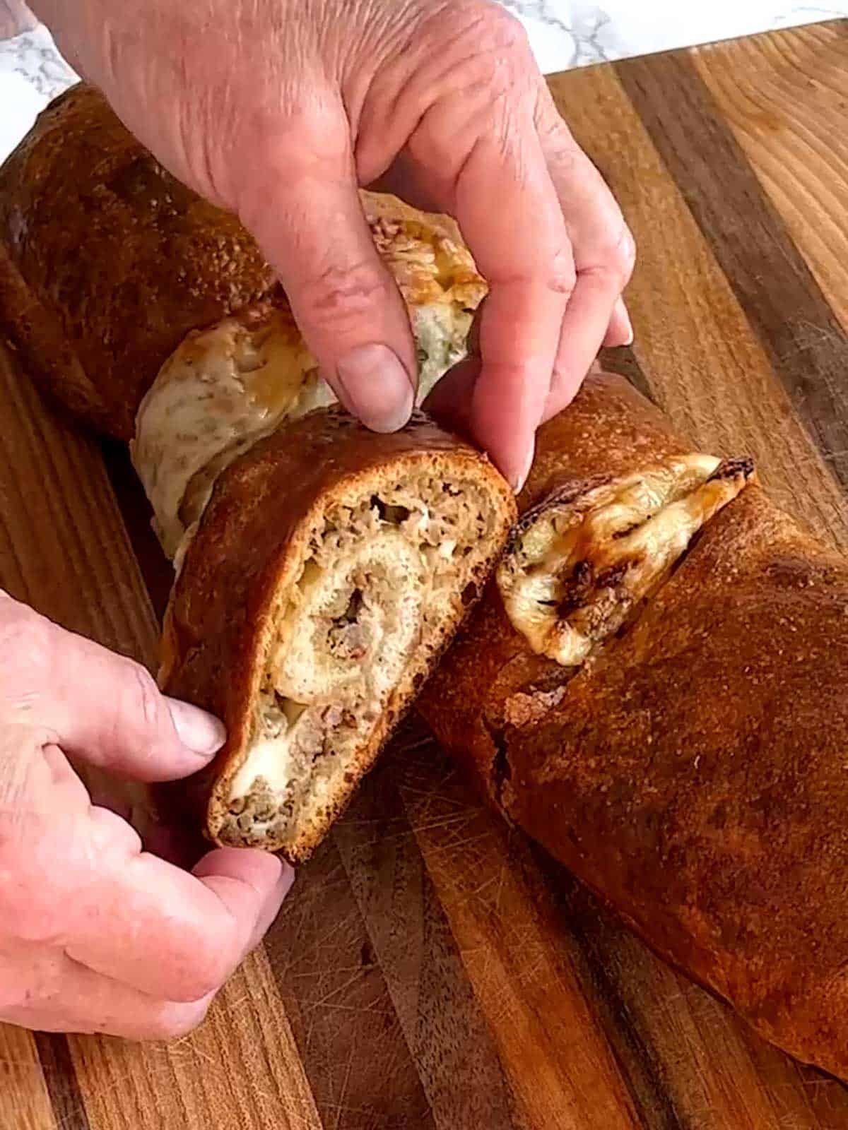 Cutting sausage bread into slices.