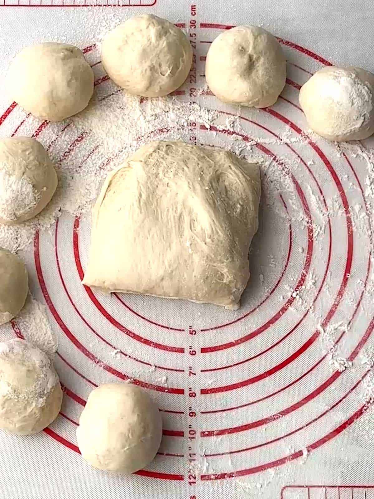 Forming dough into balls.