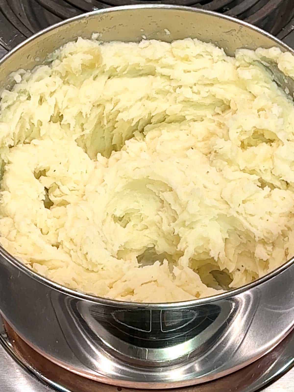 Mashed potatoes in saucepan.