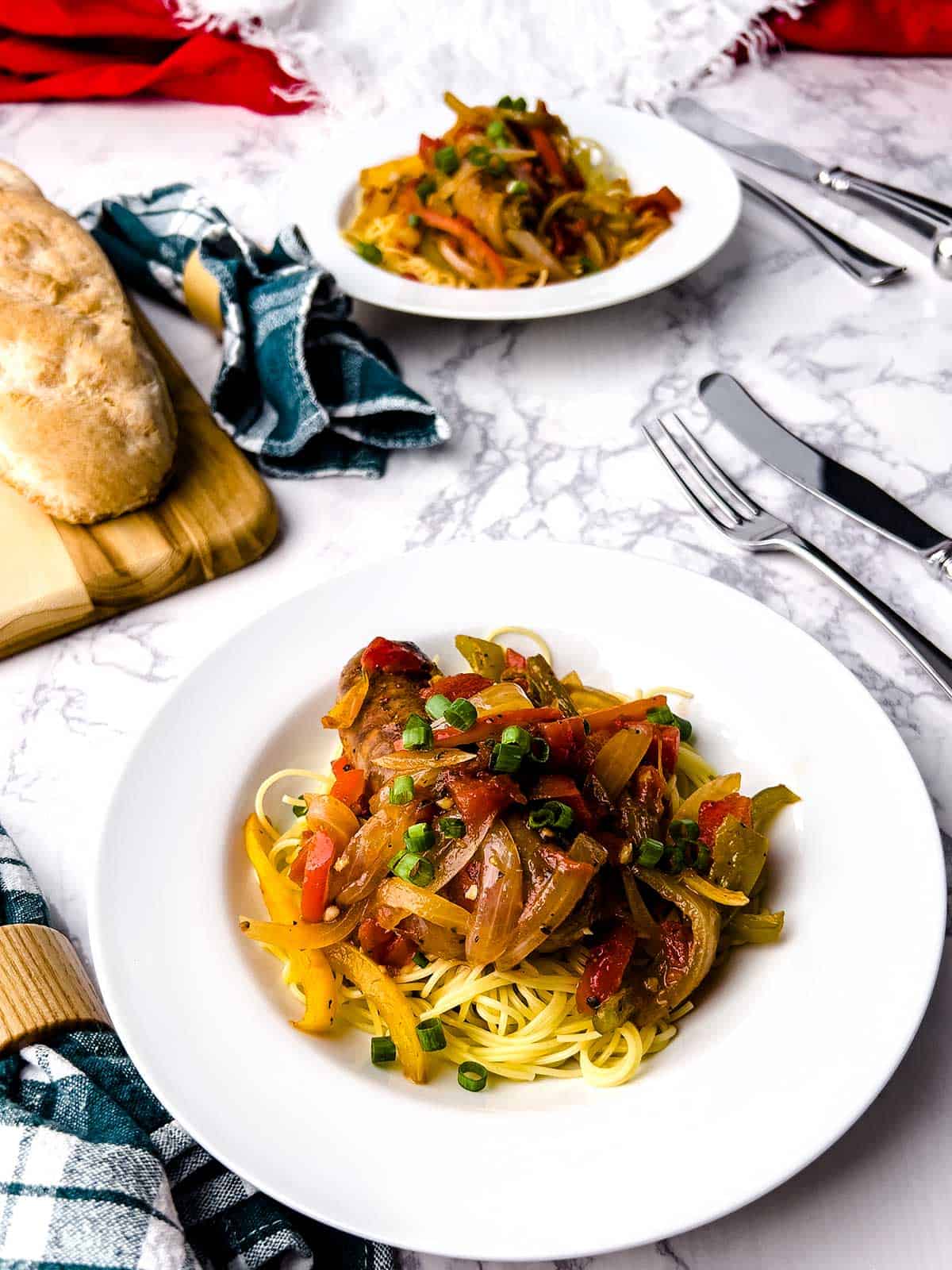Sausage, Peppers and Onions over angel hair pasta.