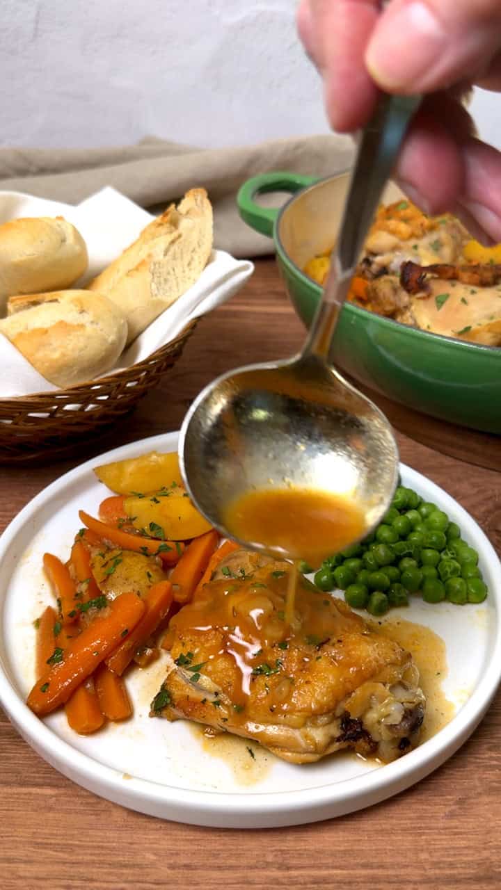 Adding gravy to the chicken thigh.