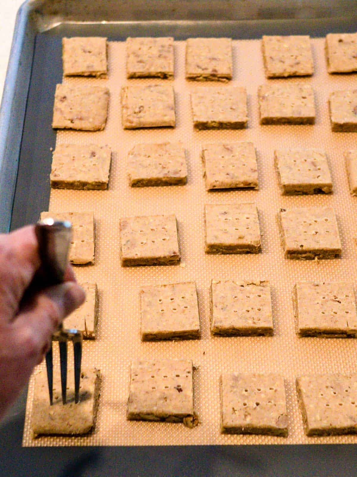 Docking the cookies with a fork.