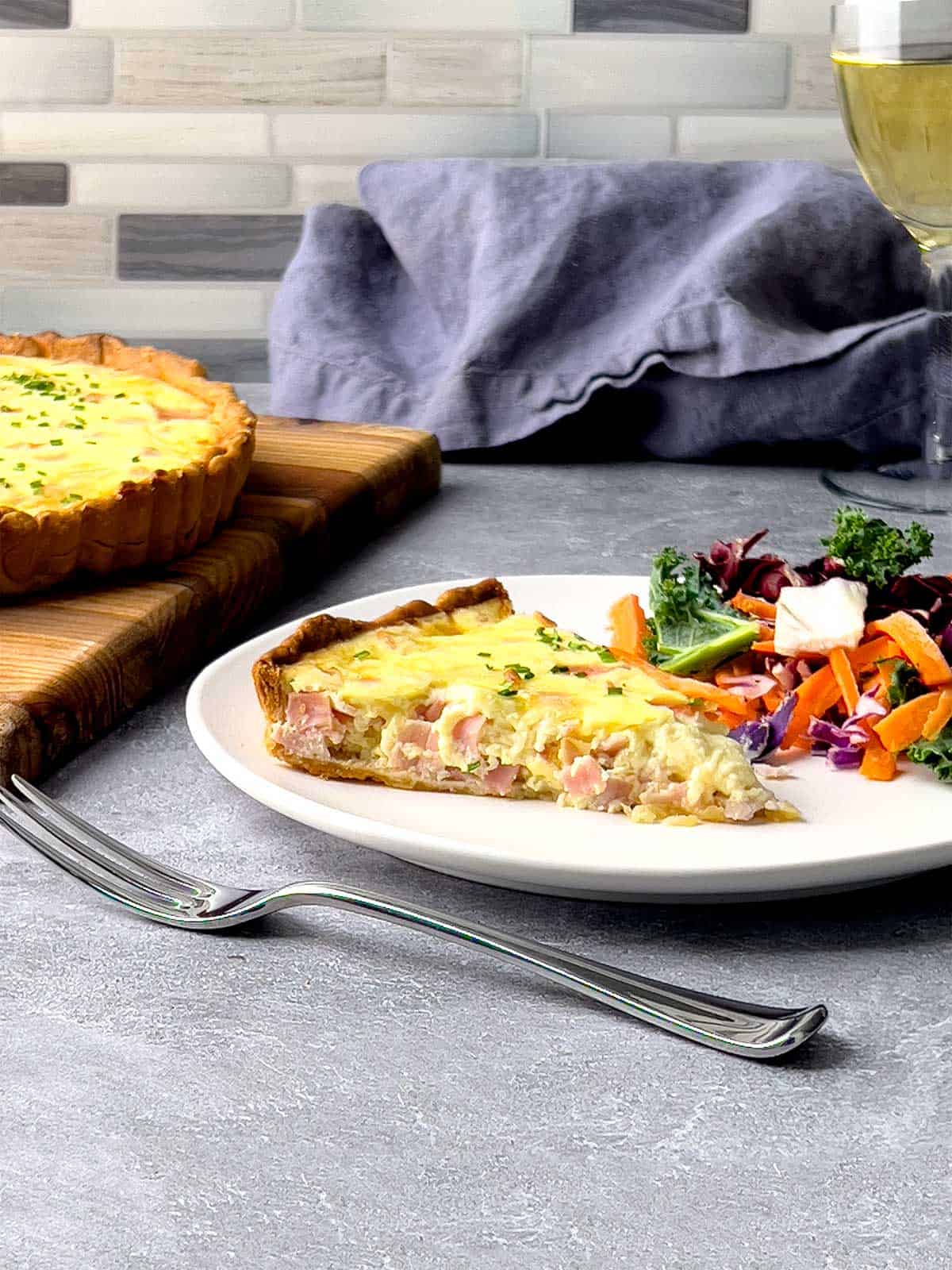 Ham and Cheese Quiche with salad.