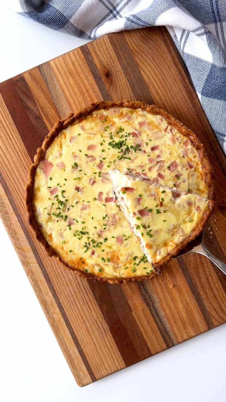 Serving the quiche.