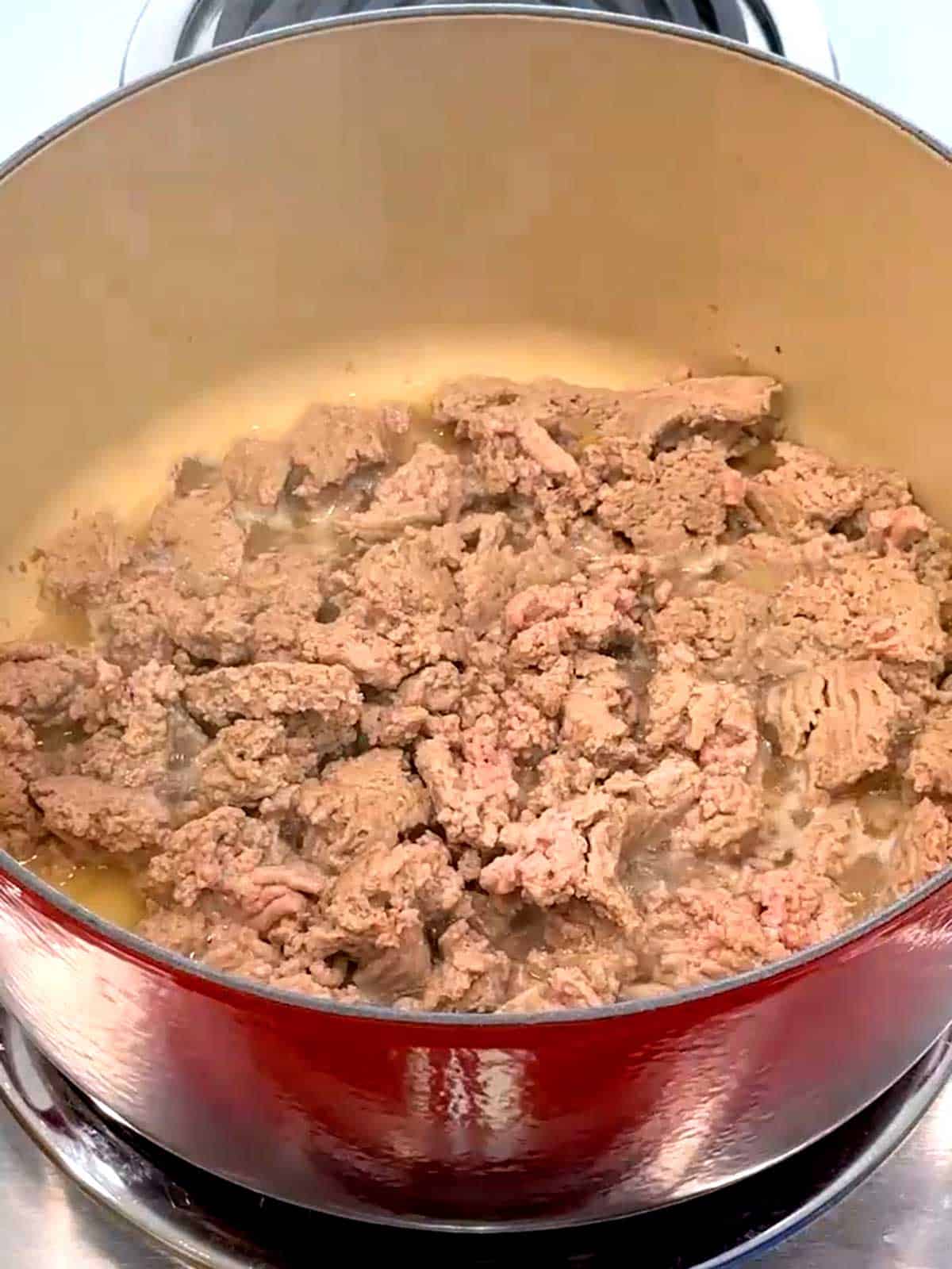 Cooking the ground turkey in a Dutch Oven.
