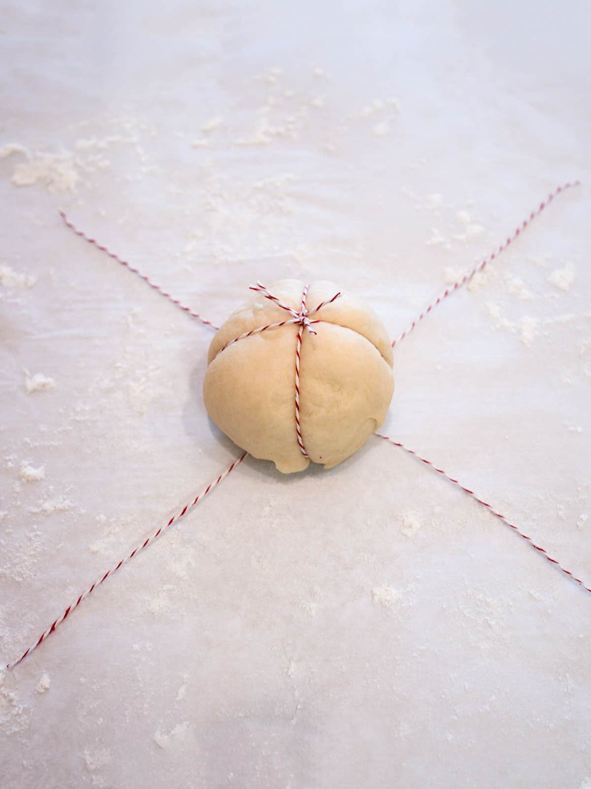 Twine tied over dough ball to form the pumpkin shape.