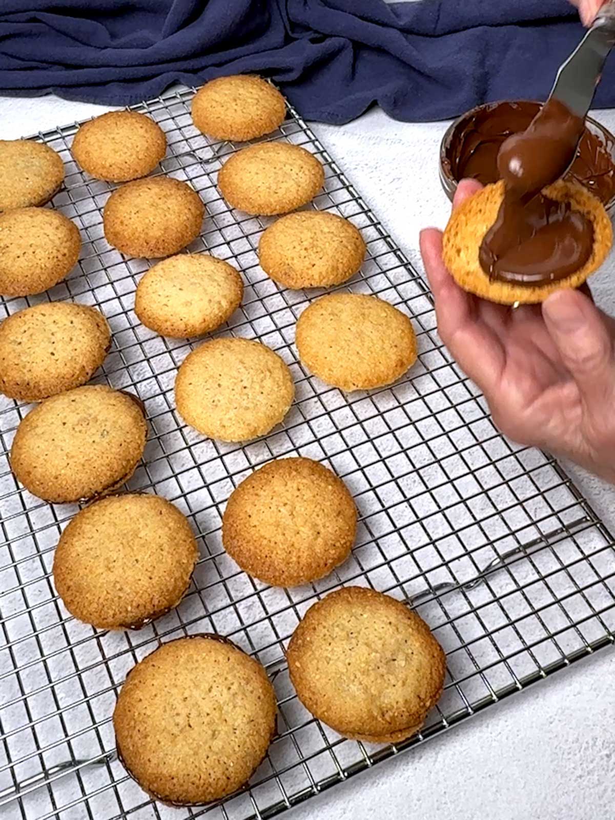 Adding chocolate to the cookie.