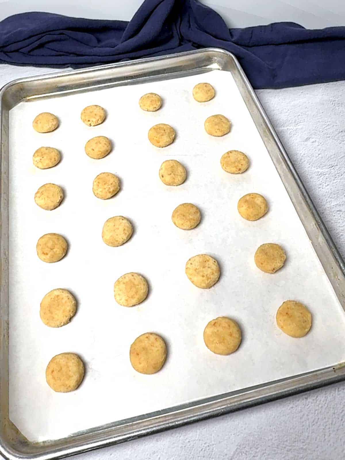Dough portioned into 10 gram pieces, rolled, and flattened.