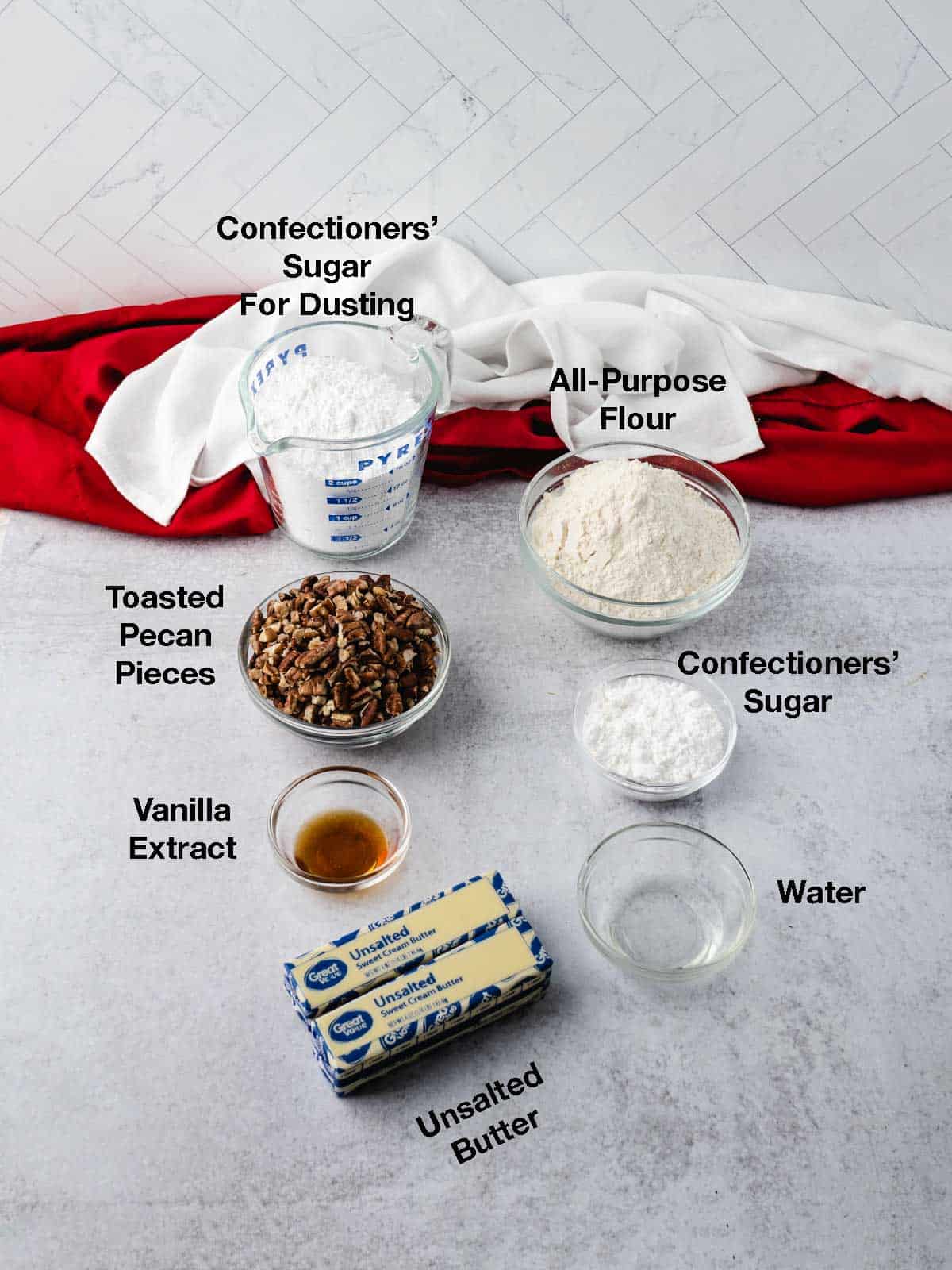 Ingredients for toasted pecan snowball cookies.