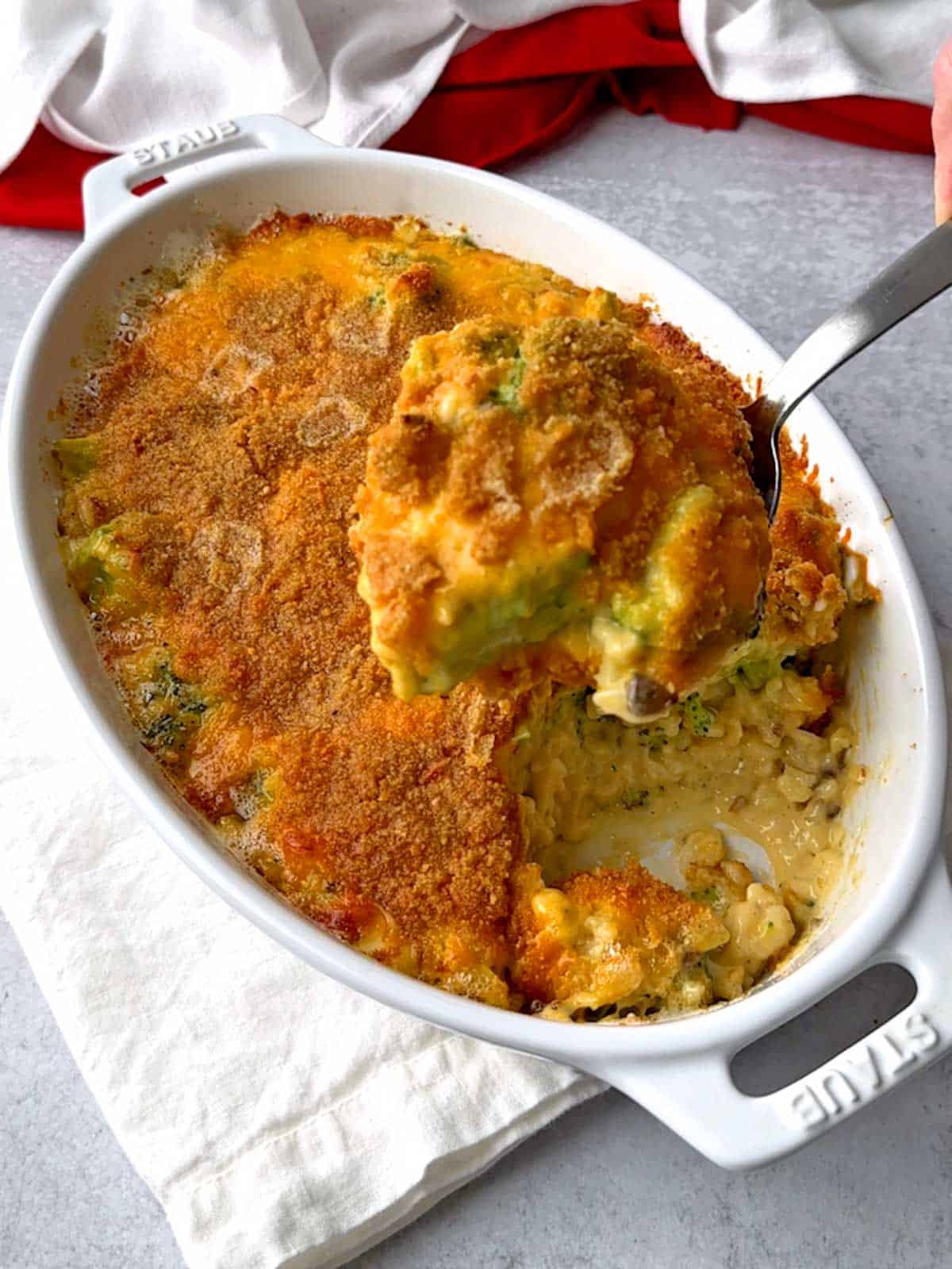 Serving the broccoli casserole.