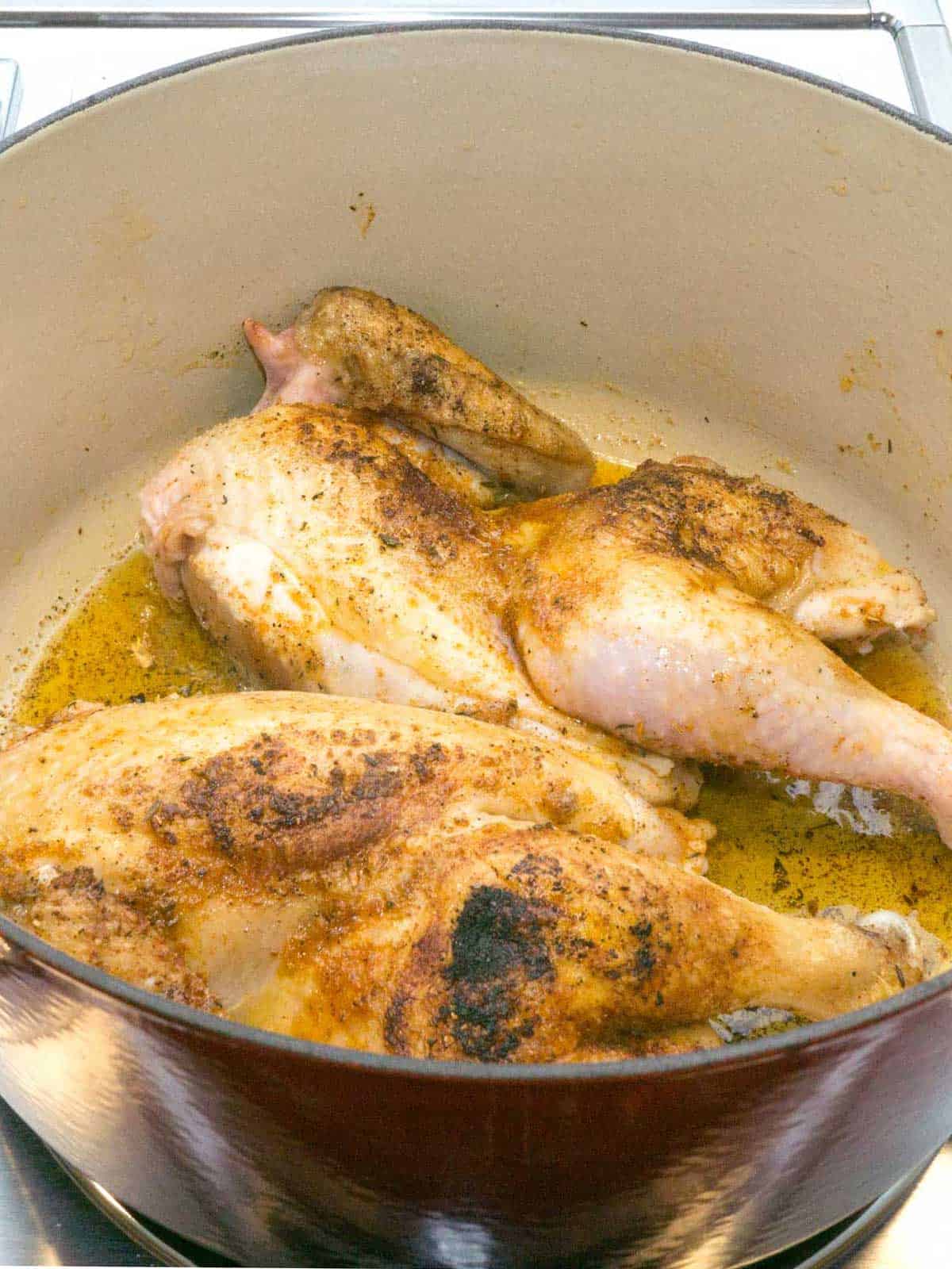 Browning chicken in a Dutch oven.