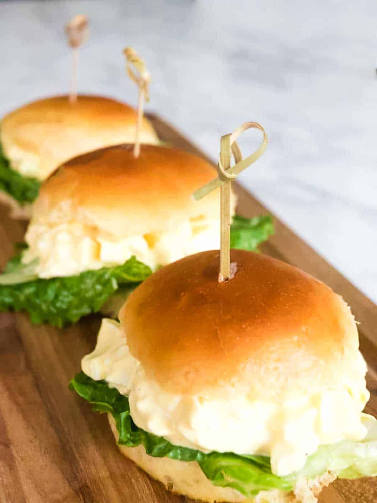 Egg salad on slider buns.,