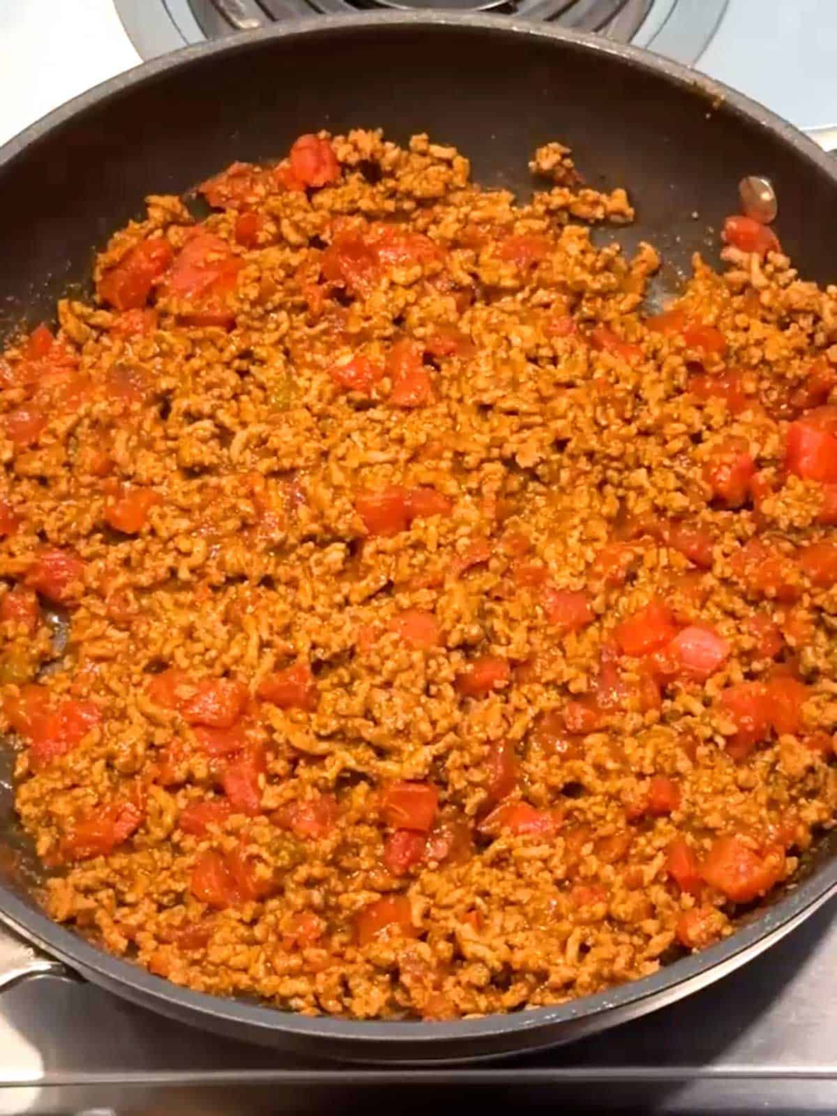 Cooked taco meat in a skillet.