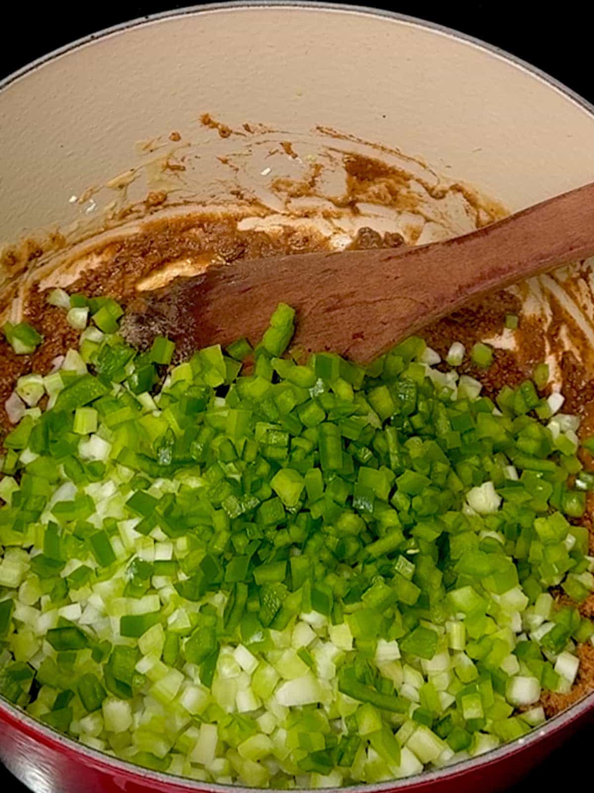 Onions, celery, and bell pepper added to the roux.