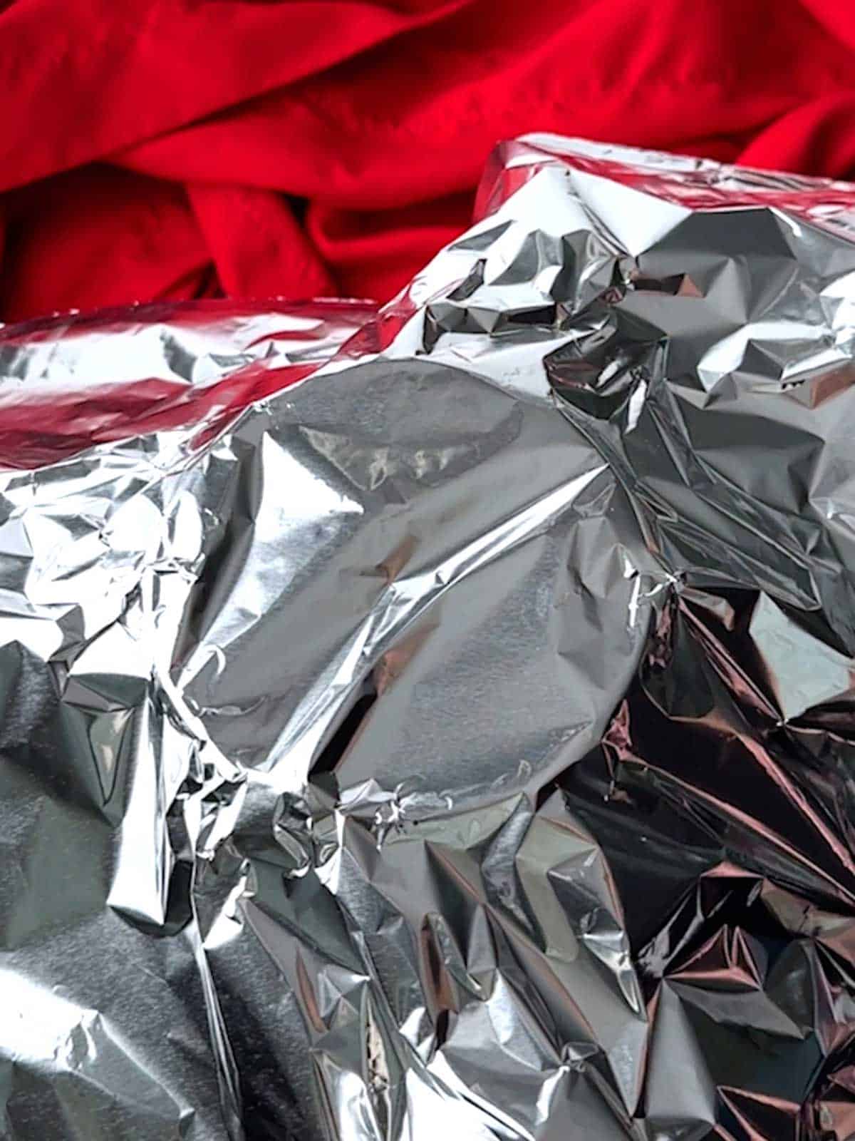 Aluminum foil covering the funnel.