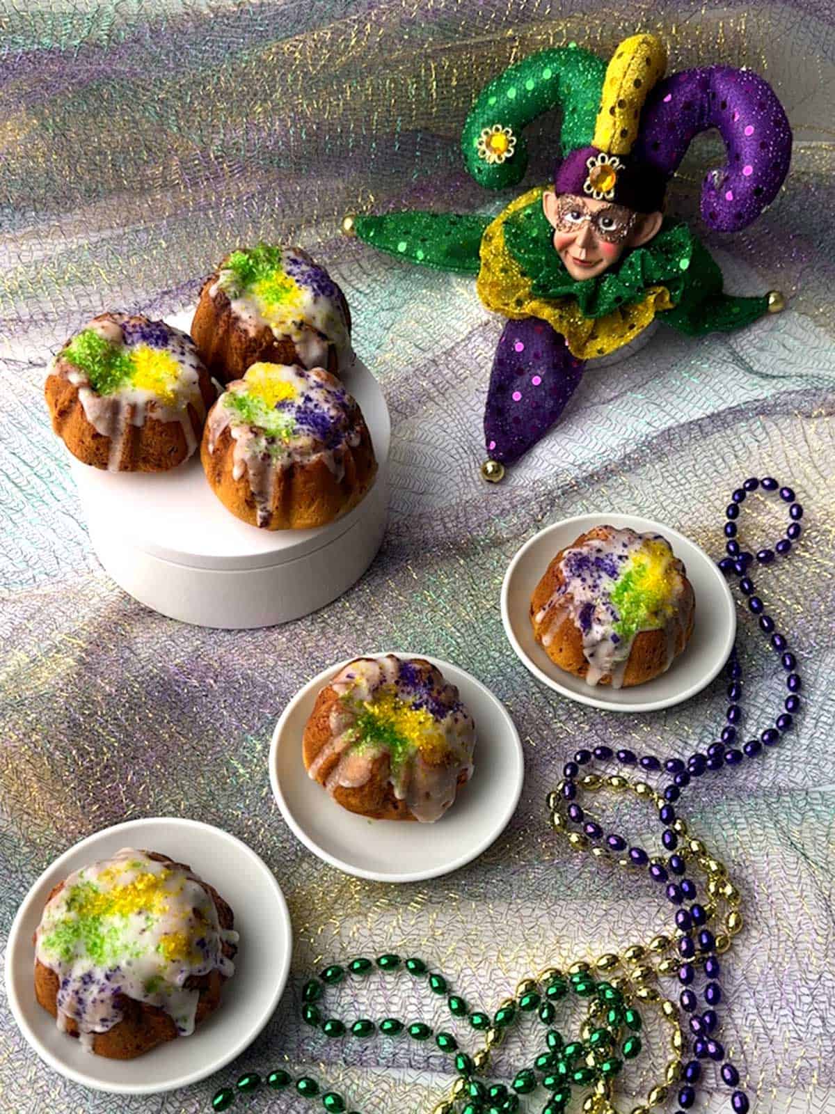 Mini king cakes made with refrigerated store-bought cinnamon rolls.