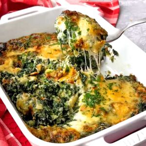 Easy make ahead Spinach Gratin being served.