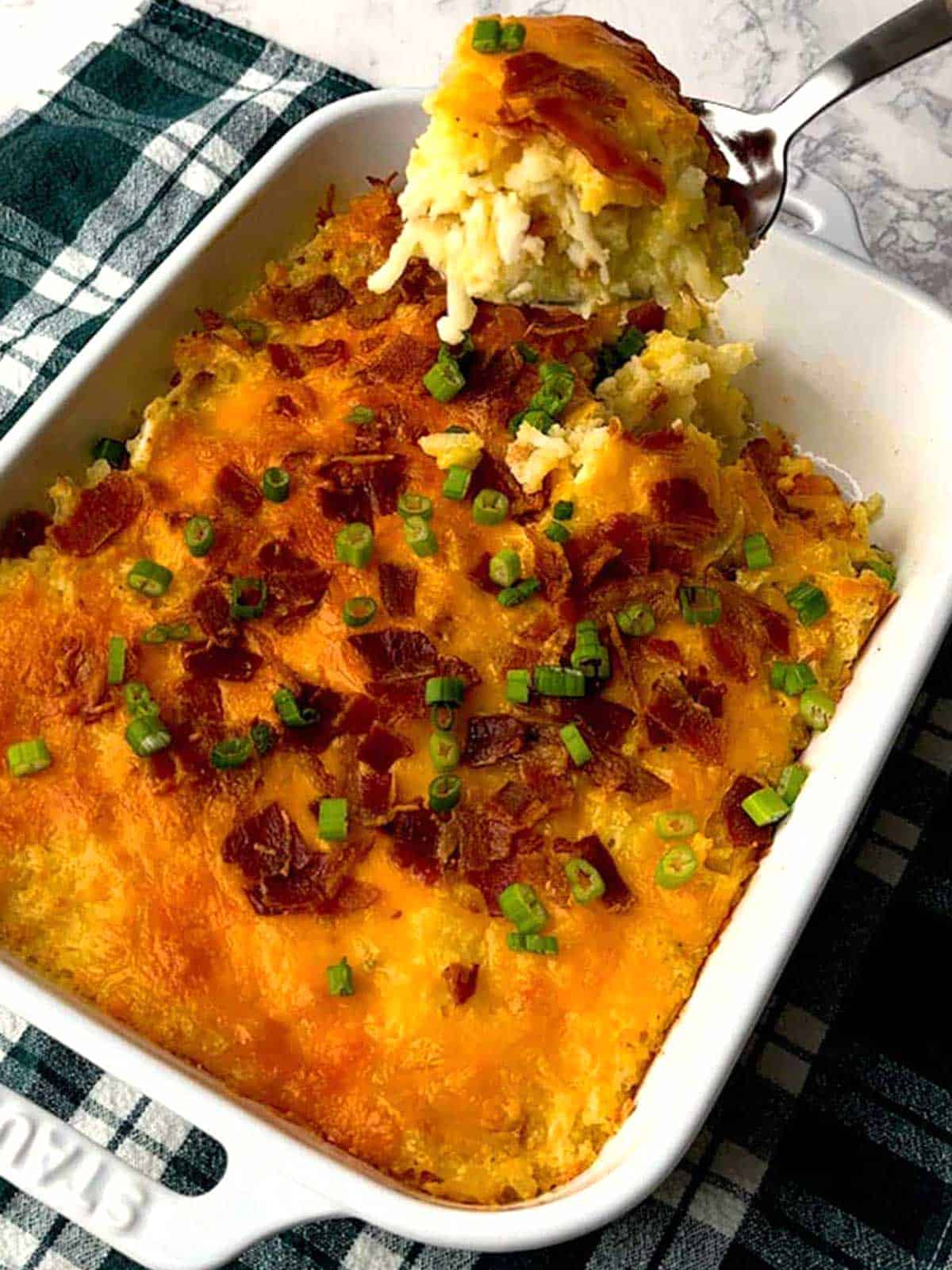 Serving the loaded potato casserole.