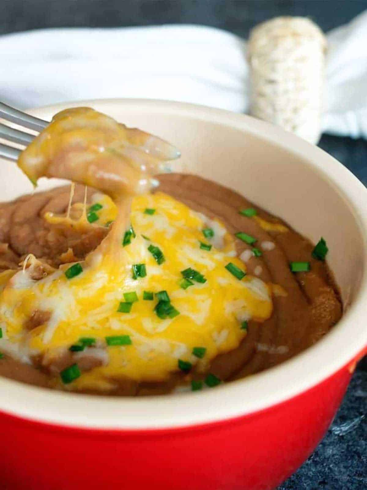 Smashed pinto beans with cheese.