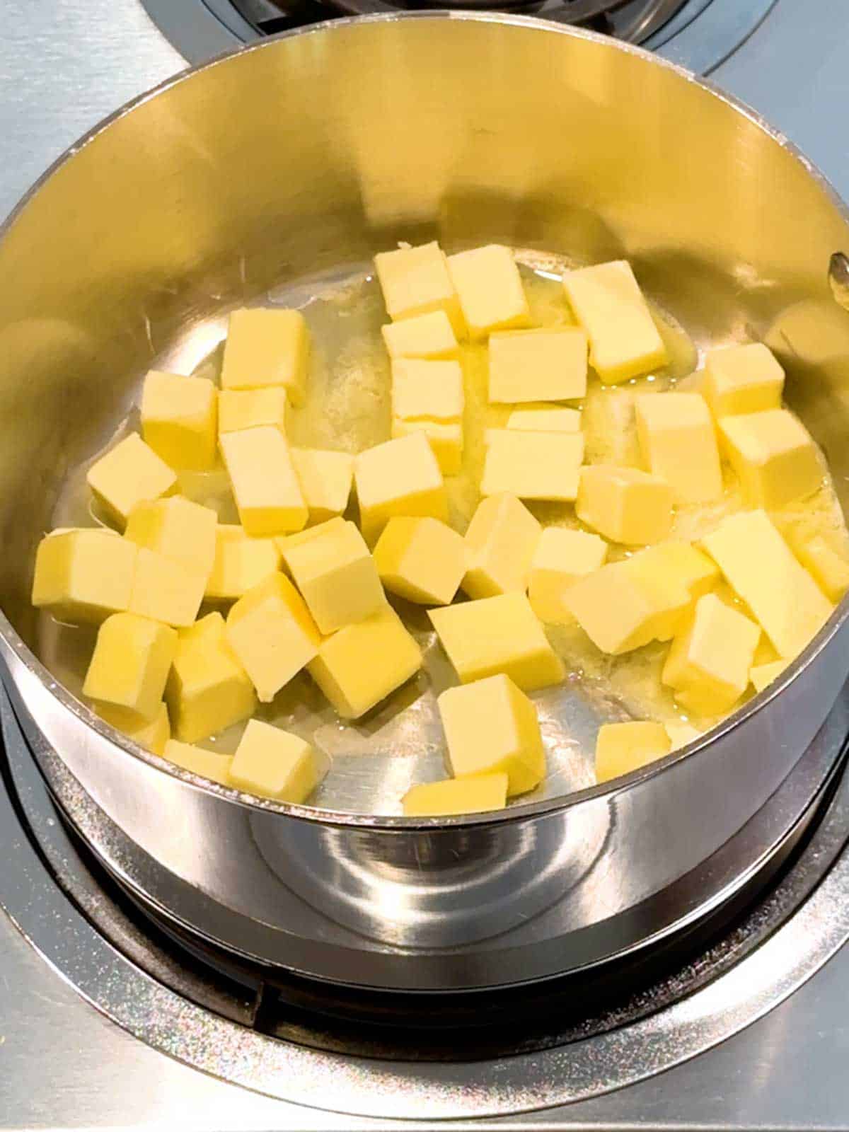 Cubed butter in a saucepan ready to melt.