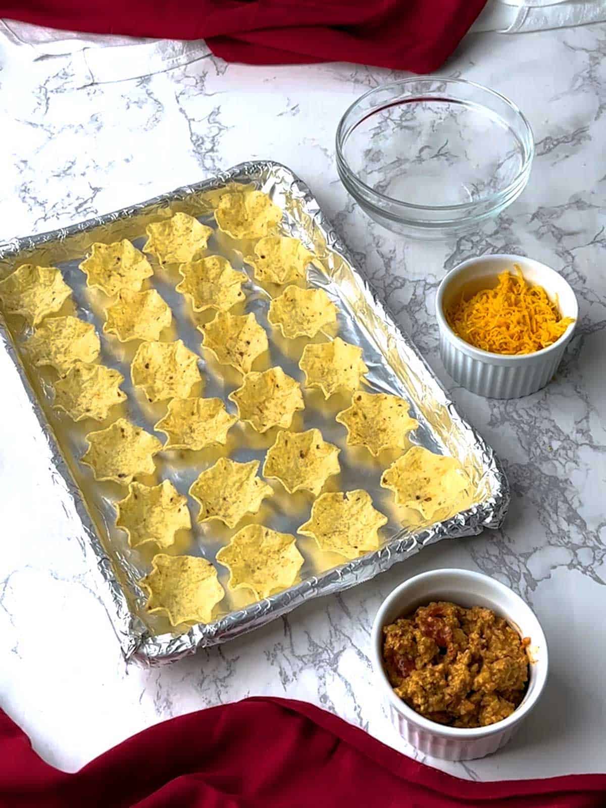 Scoops on a baking sheet lined with nonstick aluminum foil