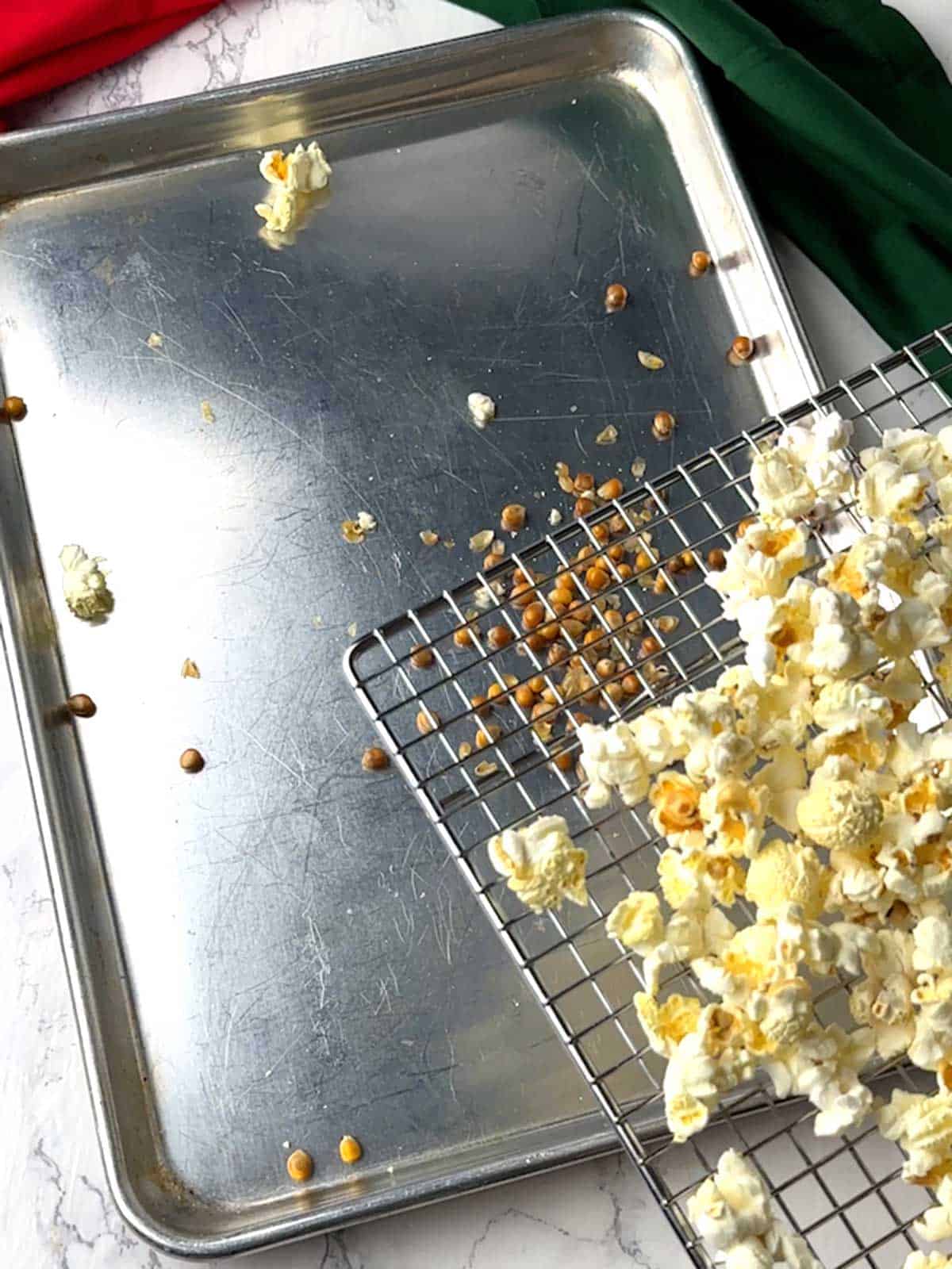 Unpopped popcorn kernels that fell though the wire rack.