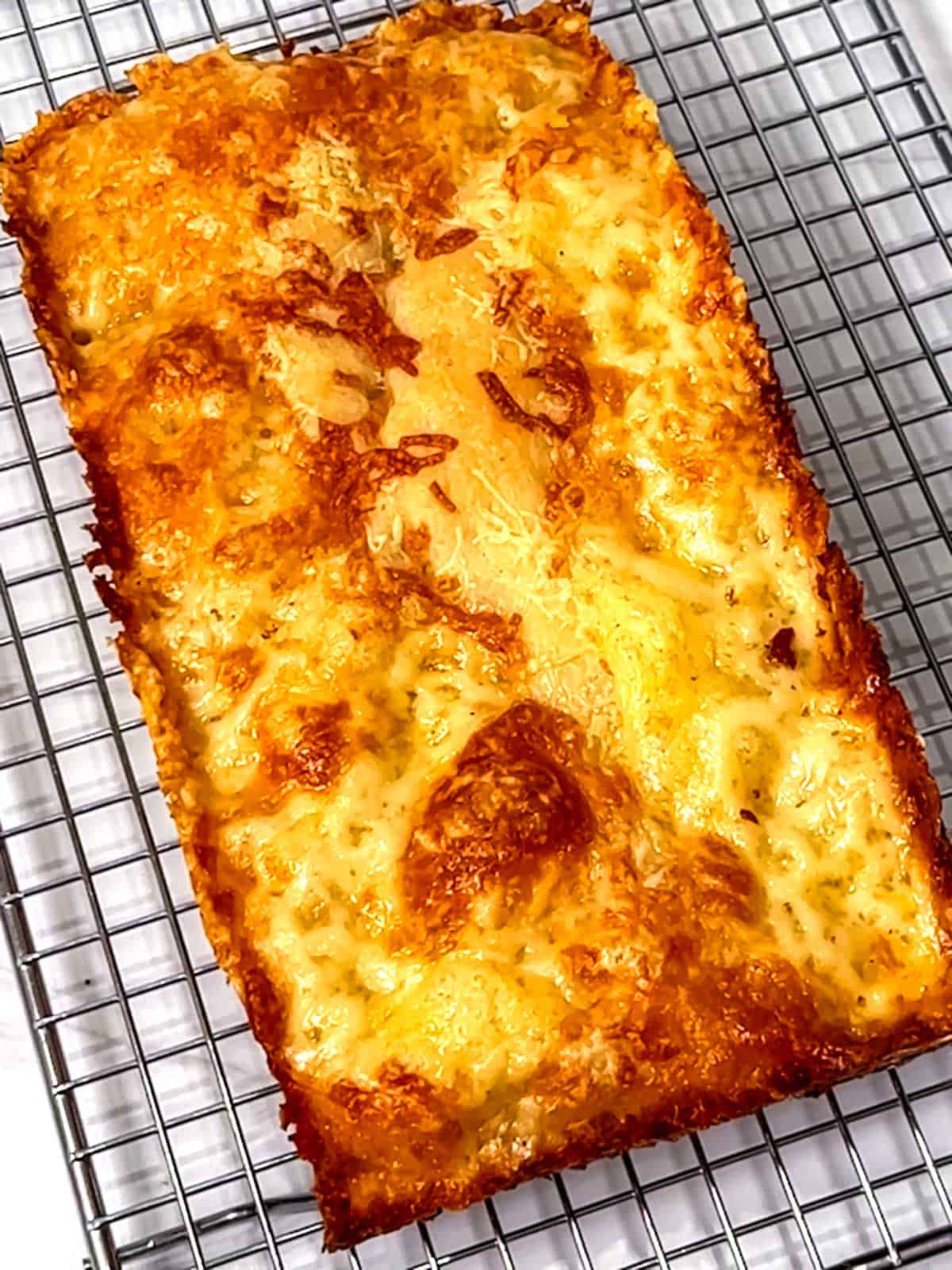 Easy Cheesy Mini Focaccia cooling on a wire rack.