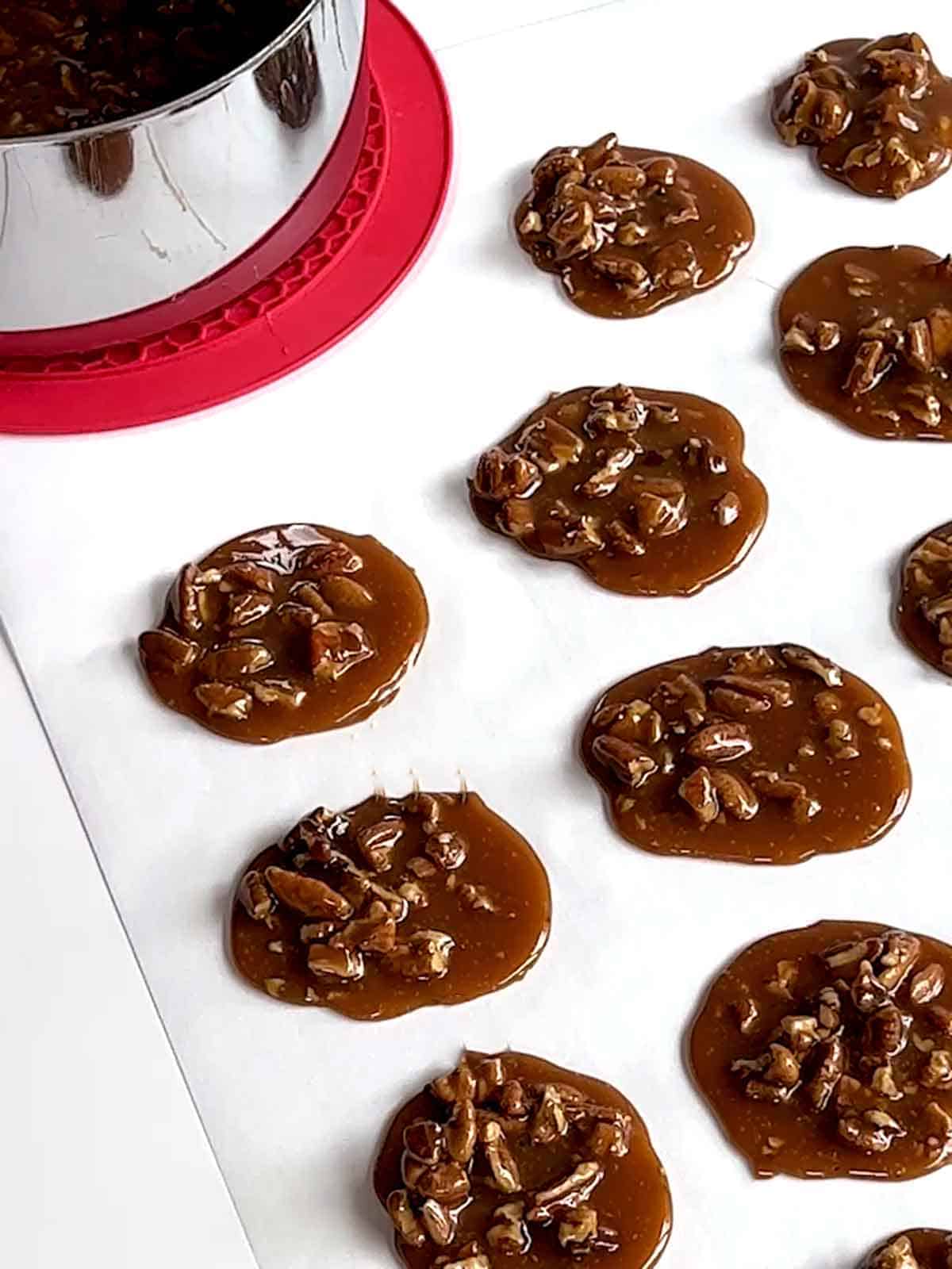 Pralines cooling on parchment paper.