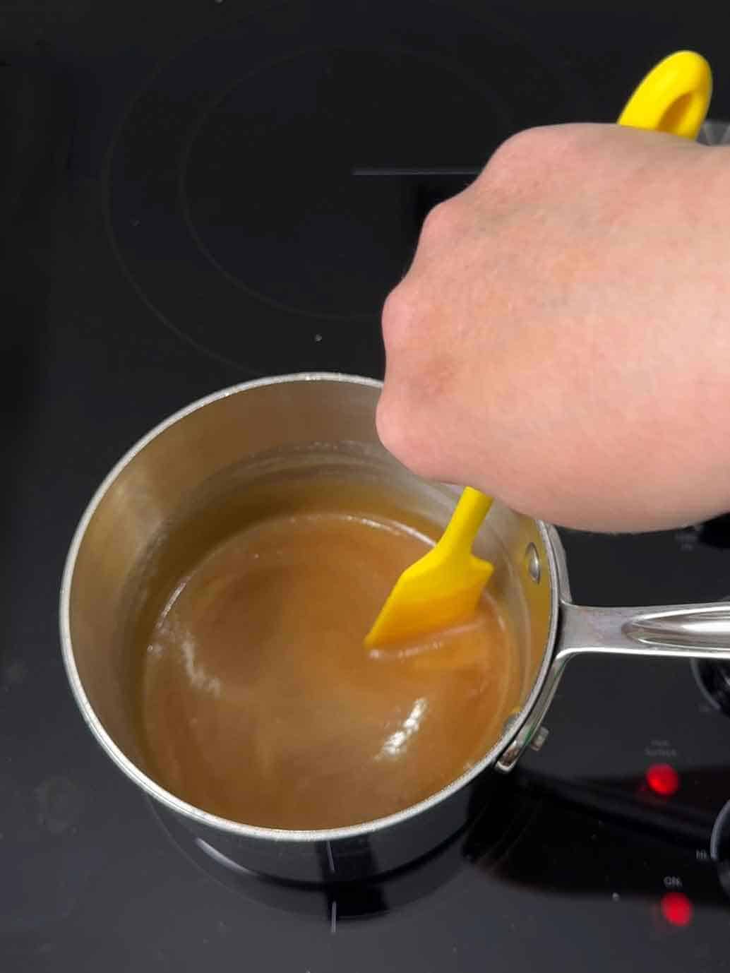 stirring sauce to combine 