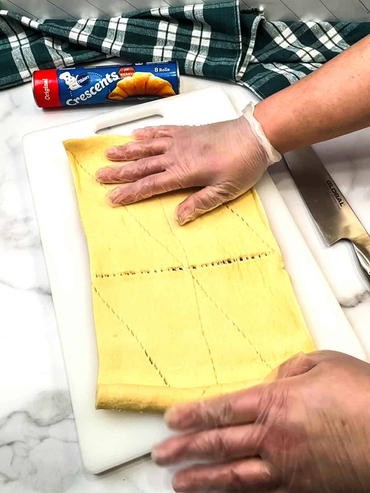 unrolling crescent roll dough