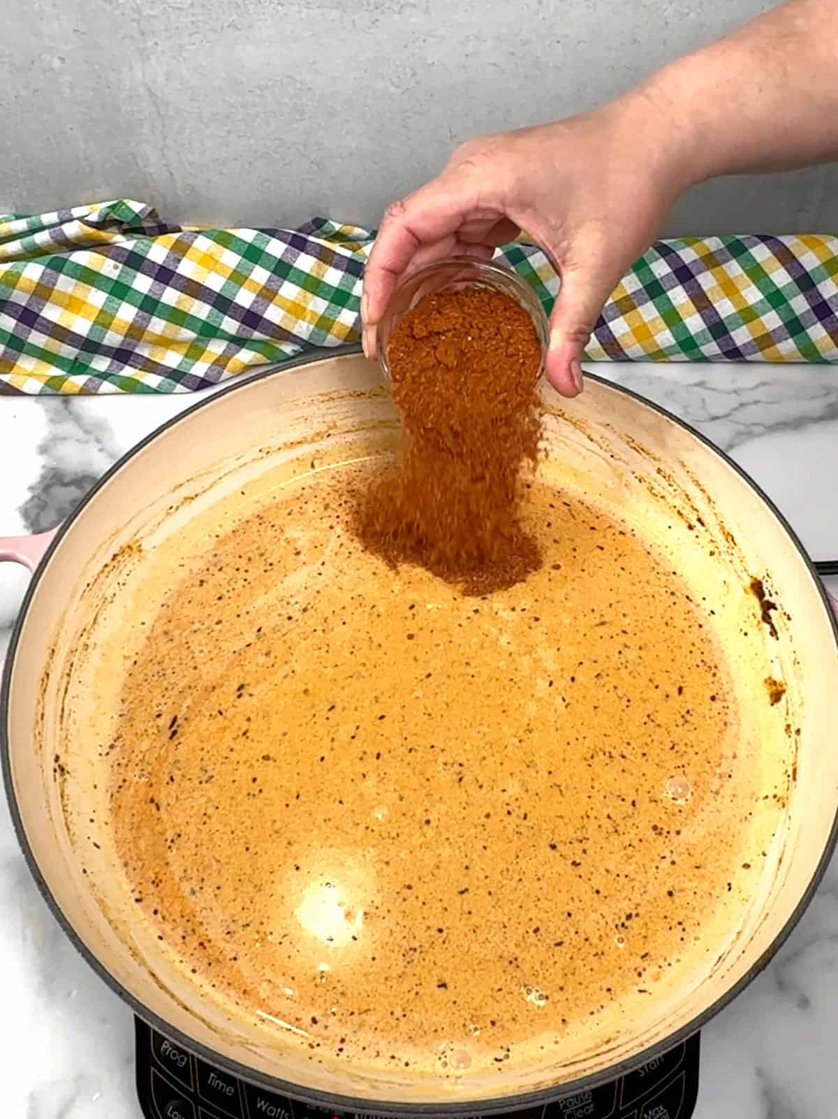 adding herbs & spices to sauce