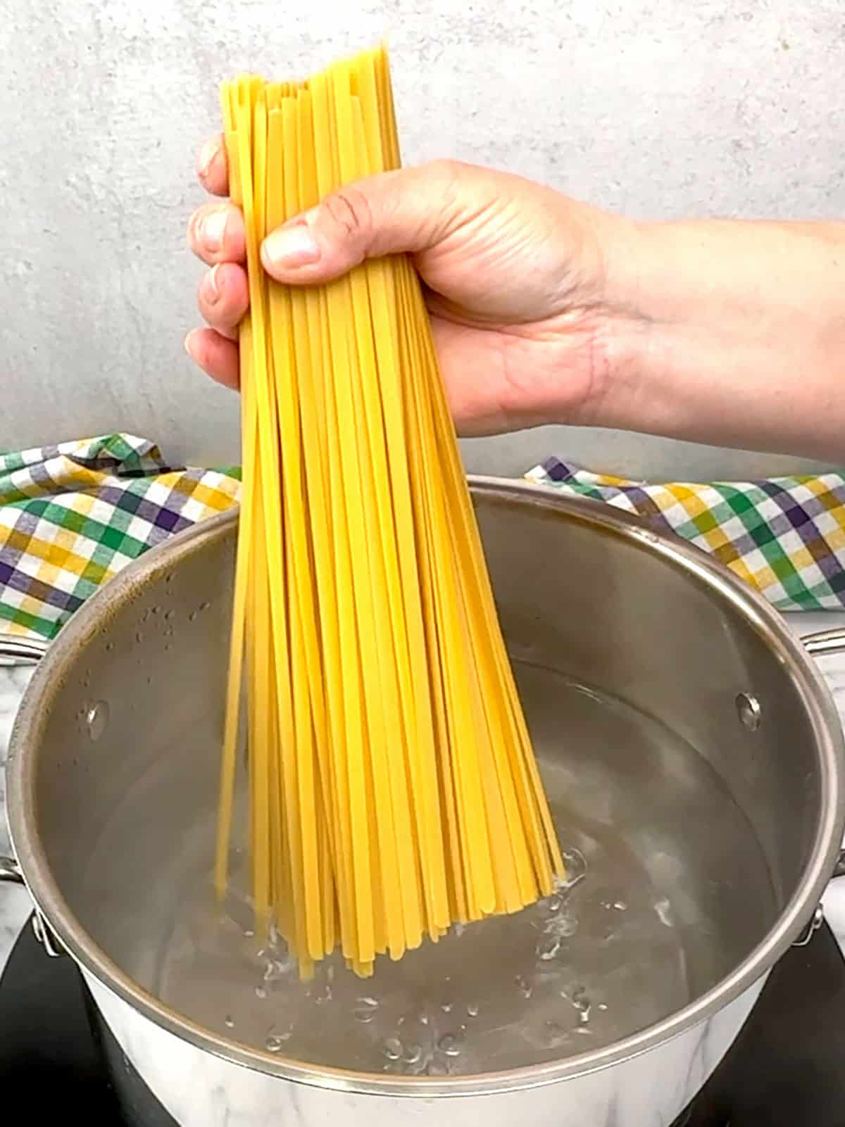 adding pasta to water
