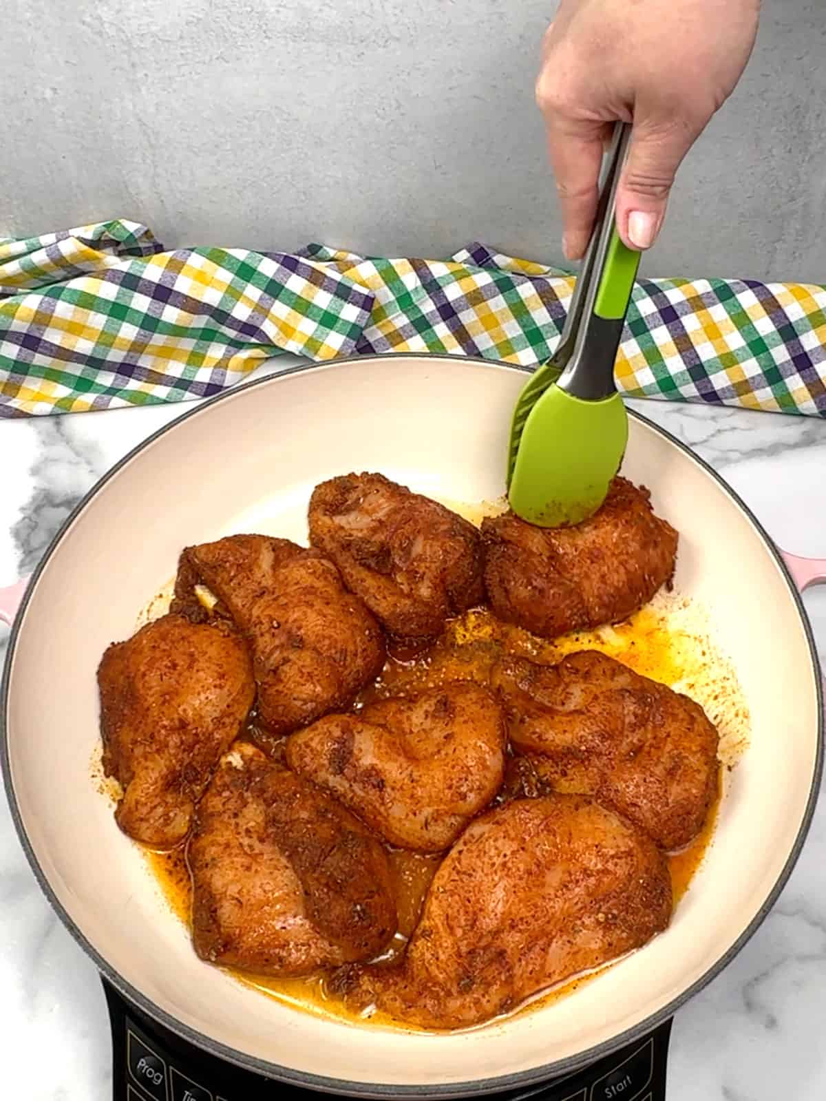 adding chicken breasts to pan