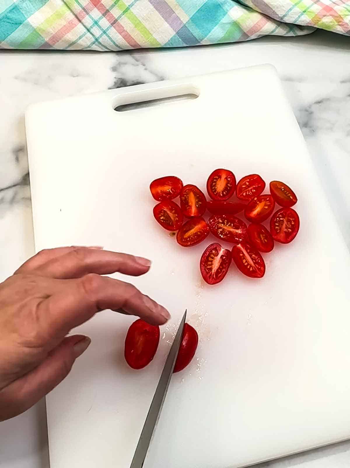 Cutting tomatoes in half