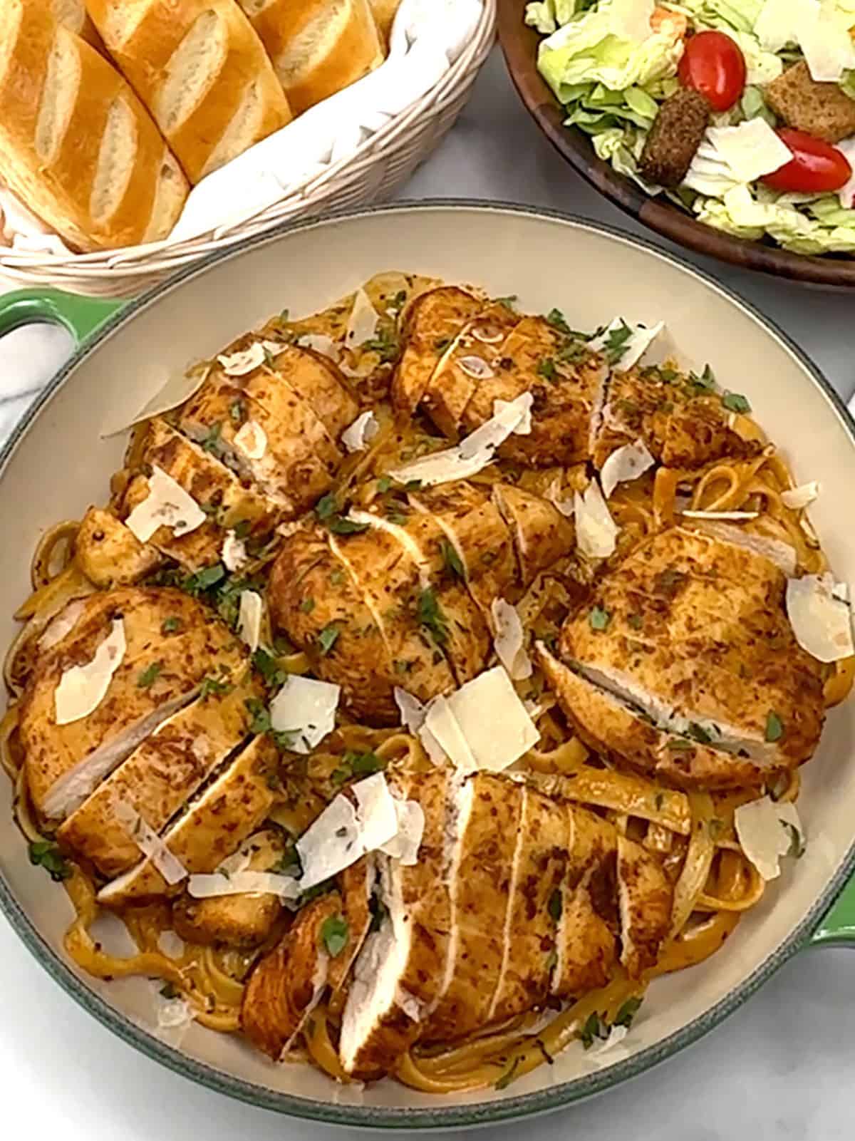 serving Cajun Blackened Chicken Alfredo