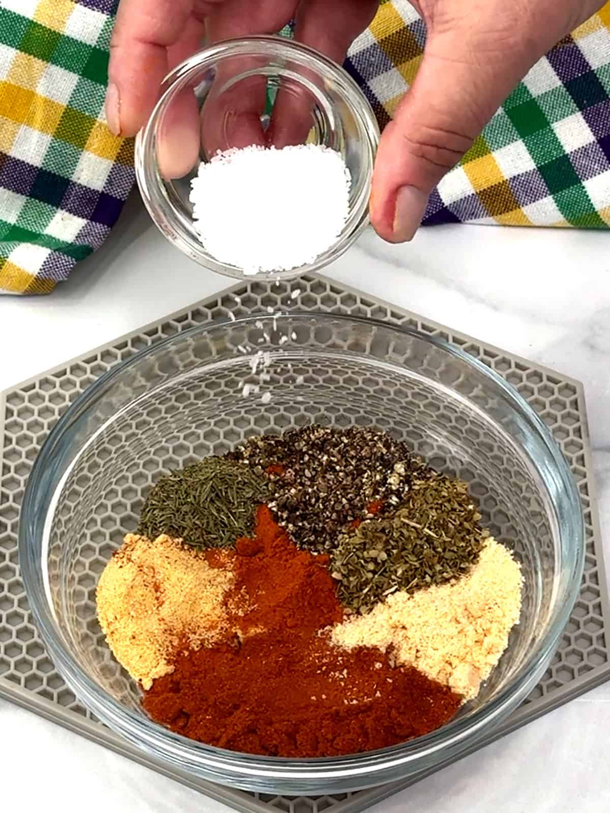 adding herbs and spices to small bowl