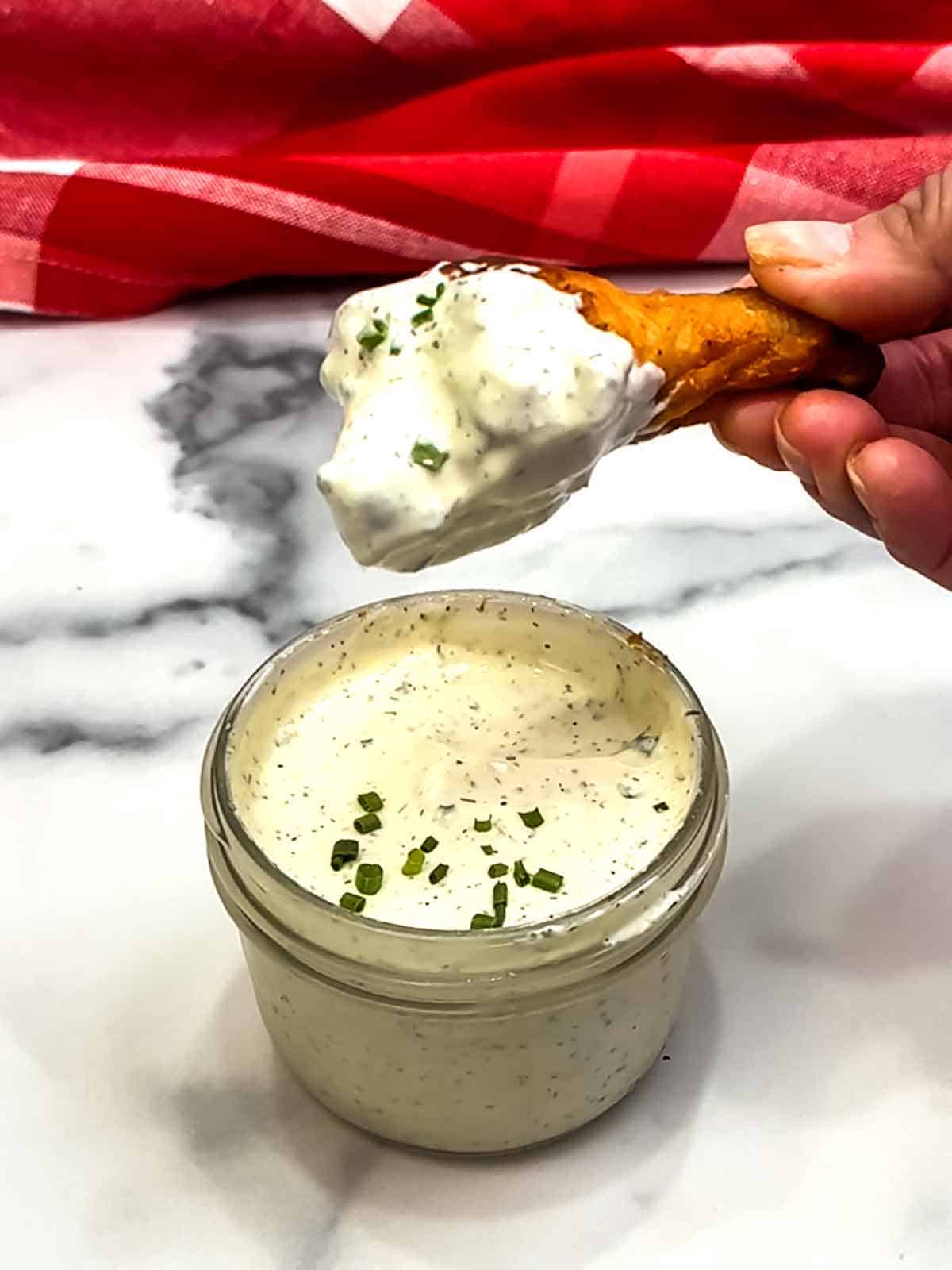 dipping wing in quick and easy homemade buttermilk ranch dressing