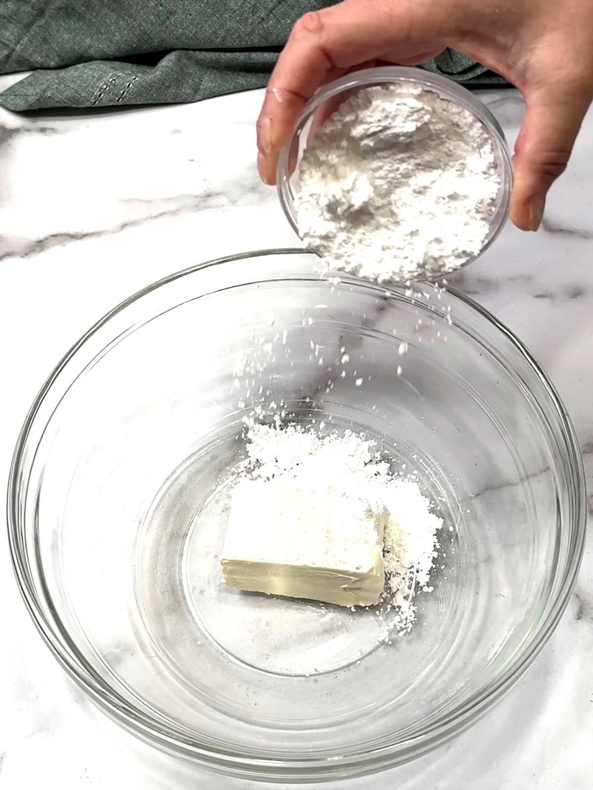 adding powdered sugar to cream cheese for whipped cream frosting