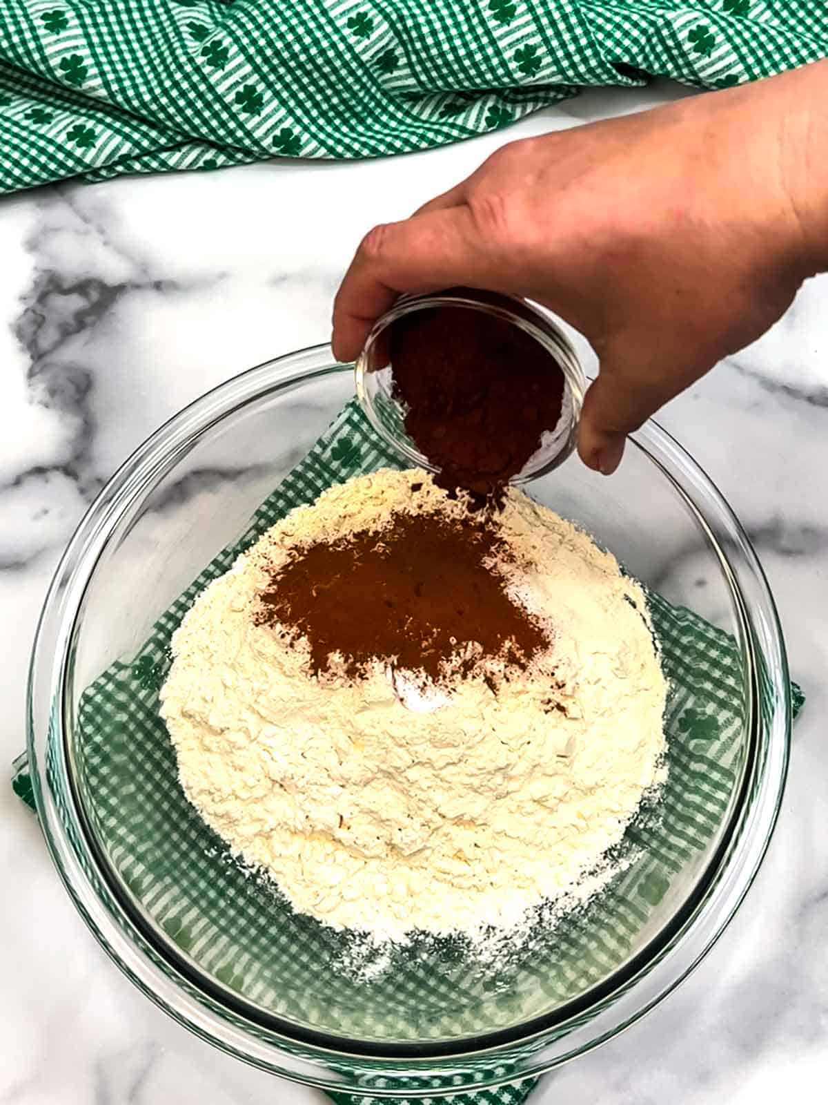 adding dry ingredients to bowl