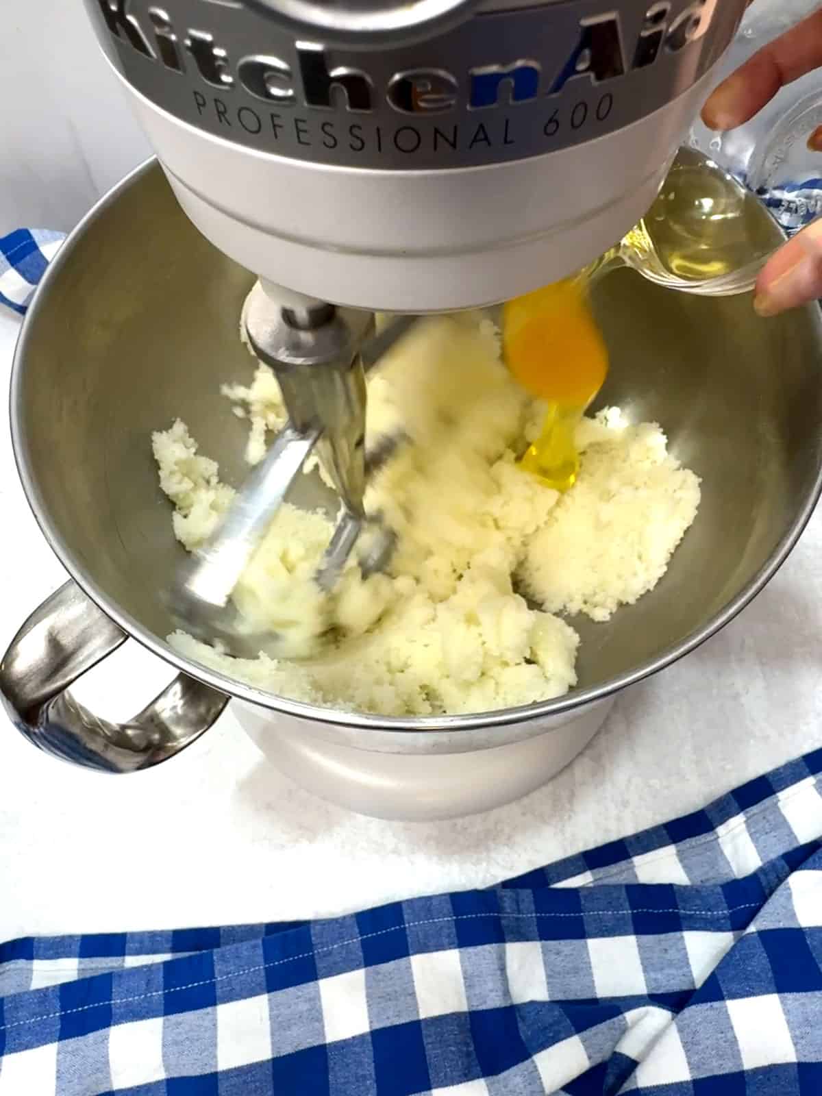 adding eggs for cake