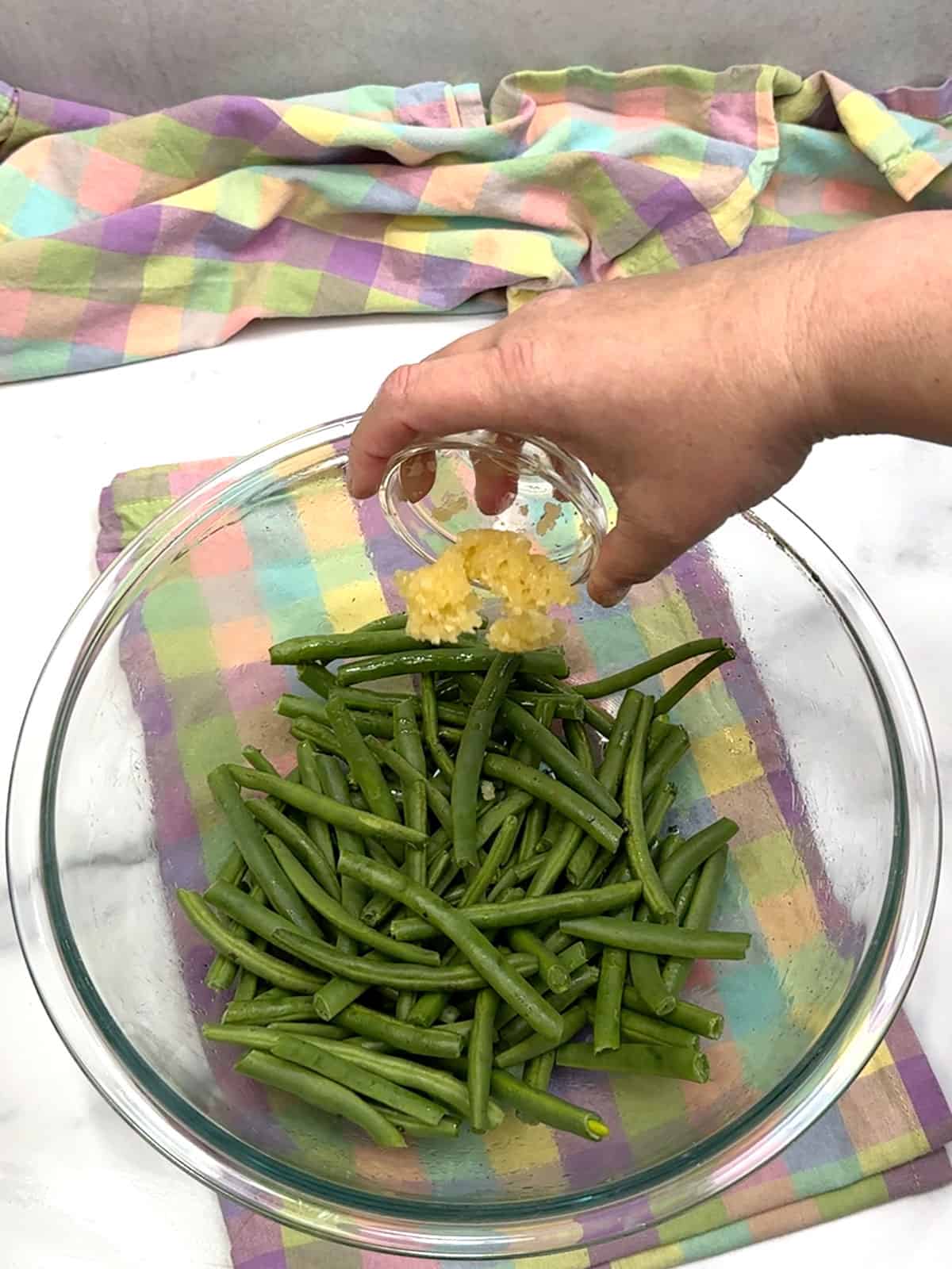 adding garlic to green beans