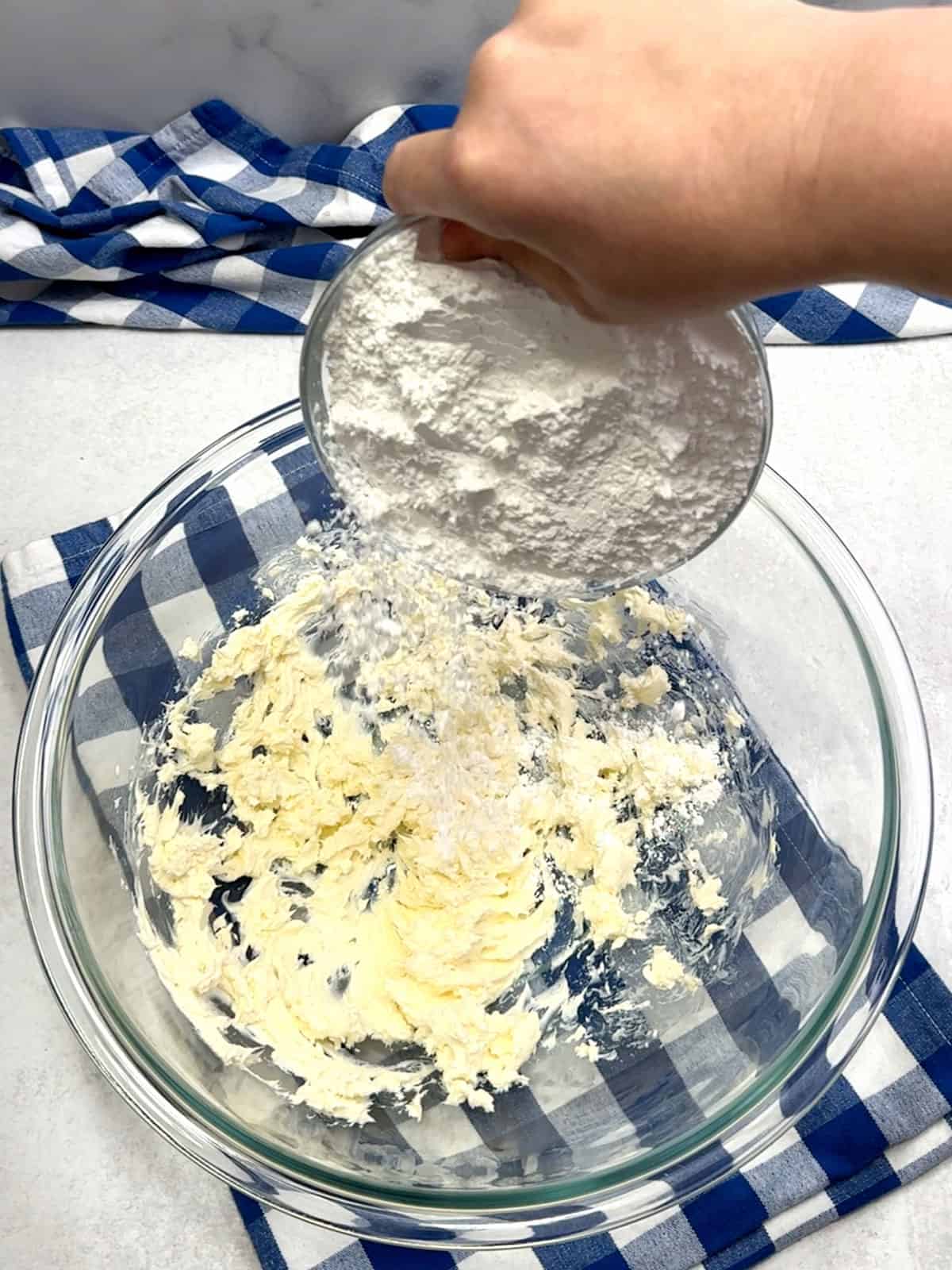 adding powdered sugar for frosting