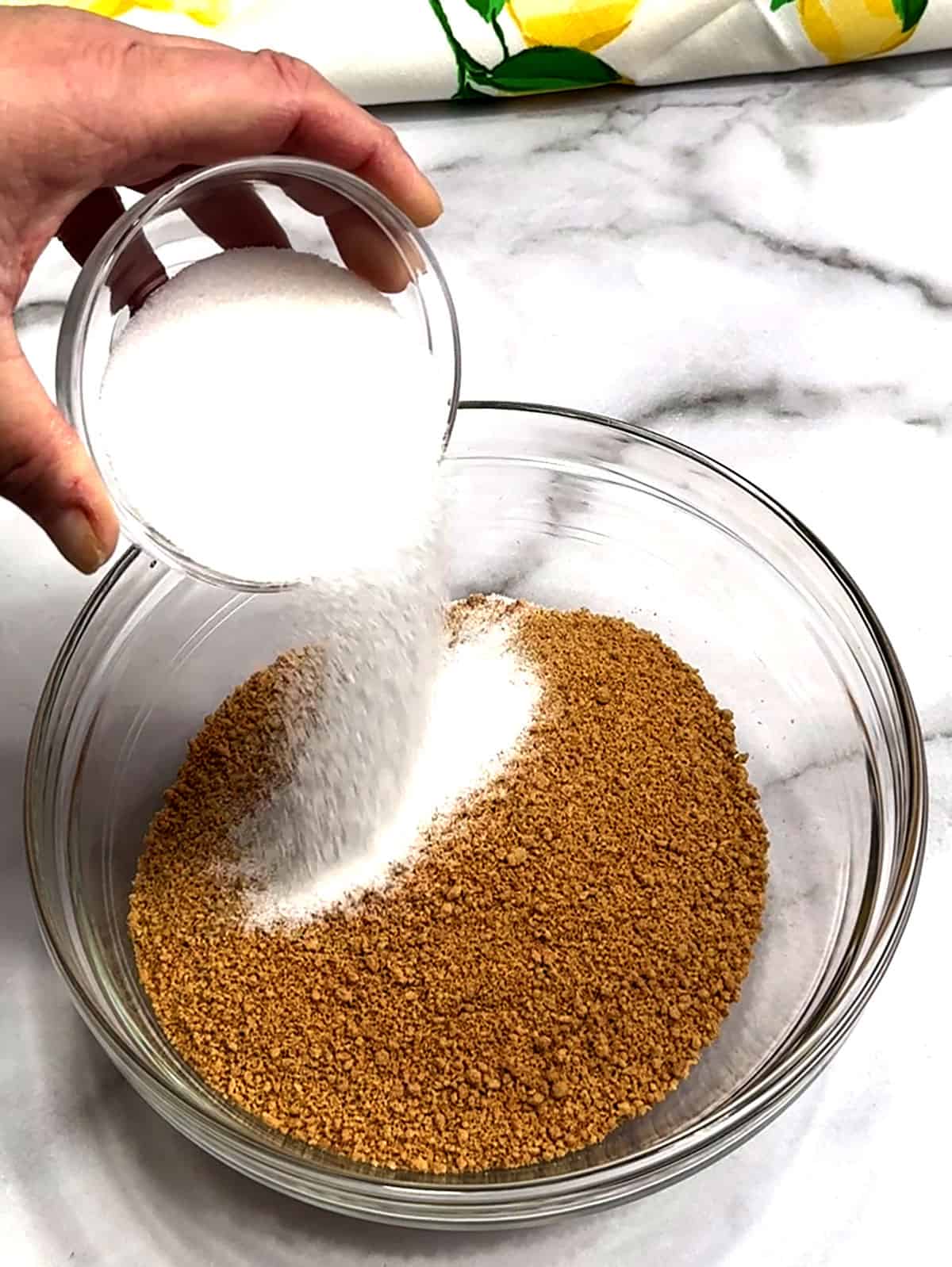 adding sugar to graham cracker crumbs for crust